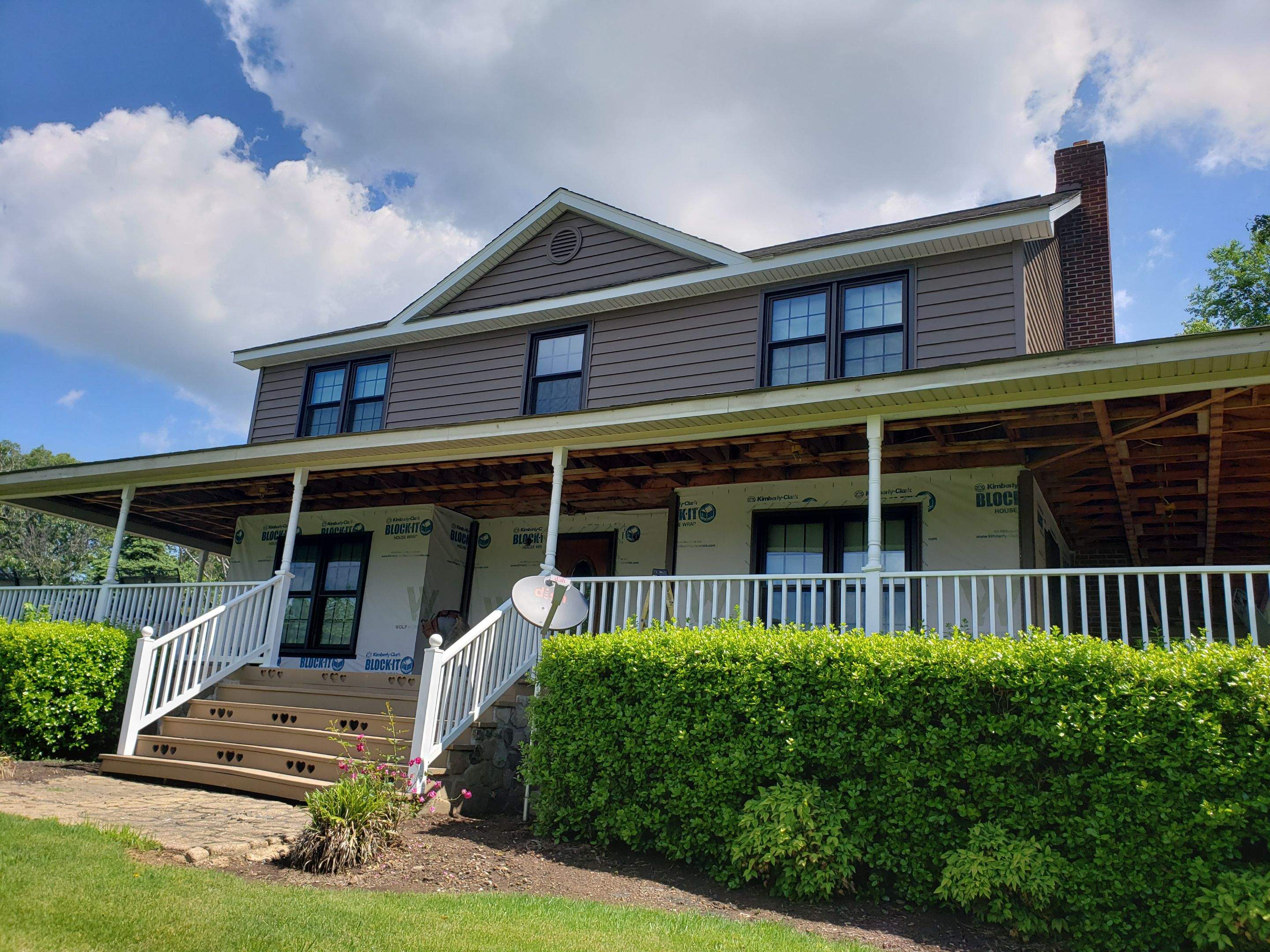 Exterior remodel including window replacement by American Home Contractors