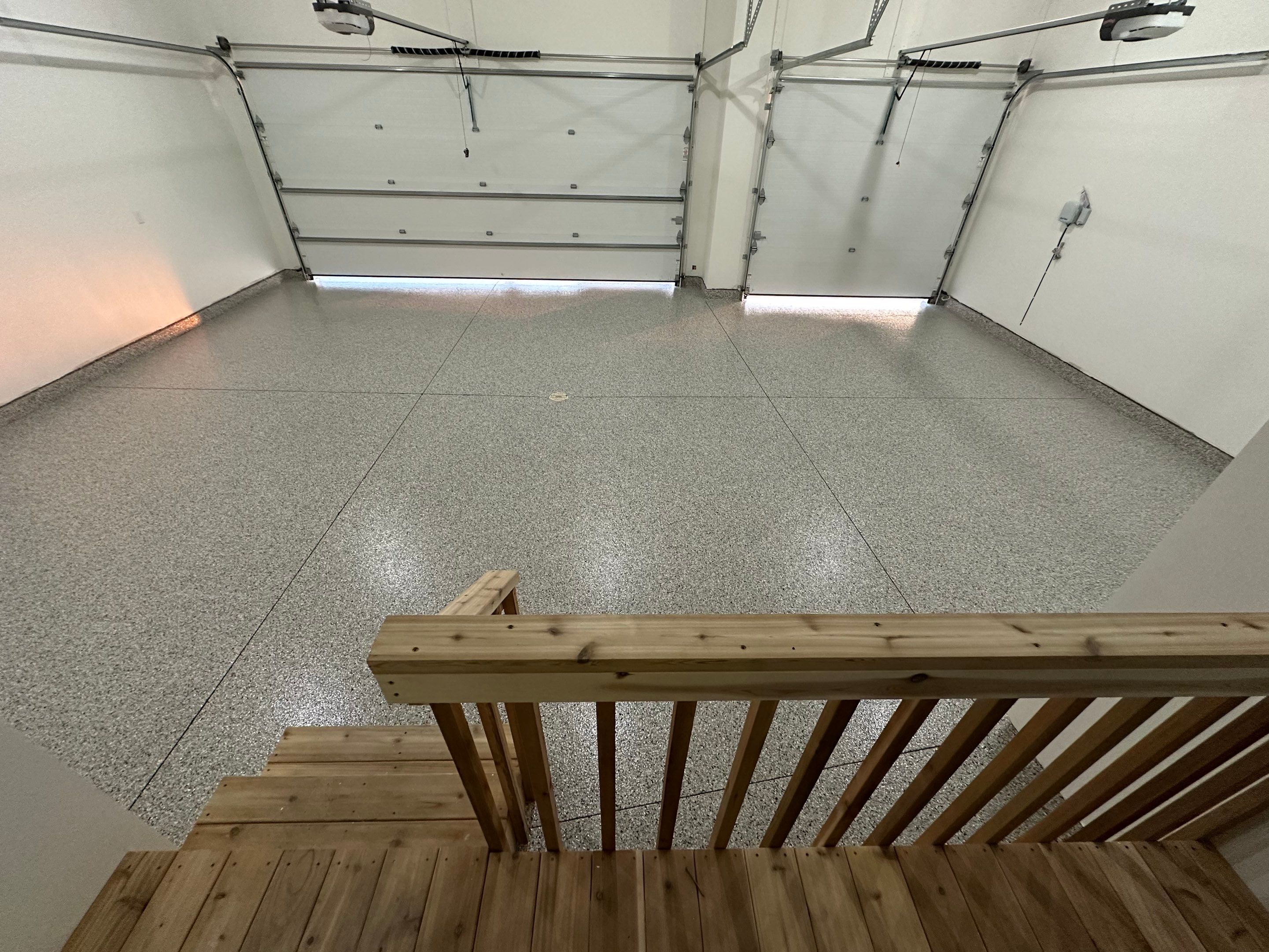 Cabin Fever Decorative Flake Garage Floor Coating in Sioux Falls by Select Painting, Coatings & Garage Cabinets