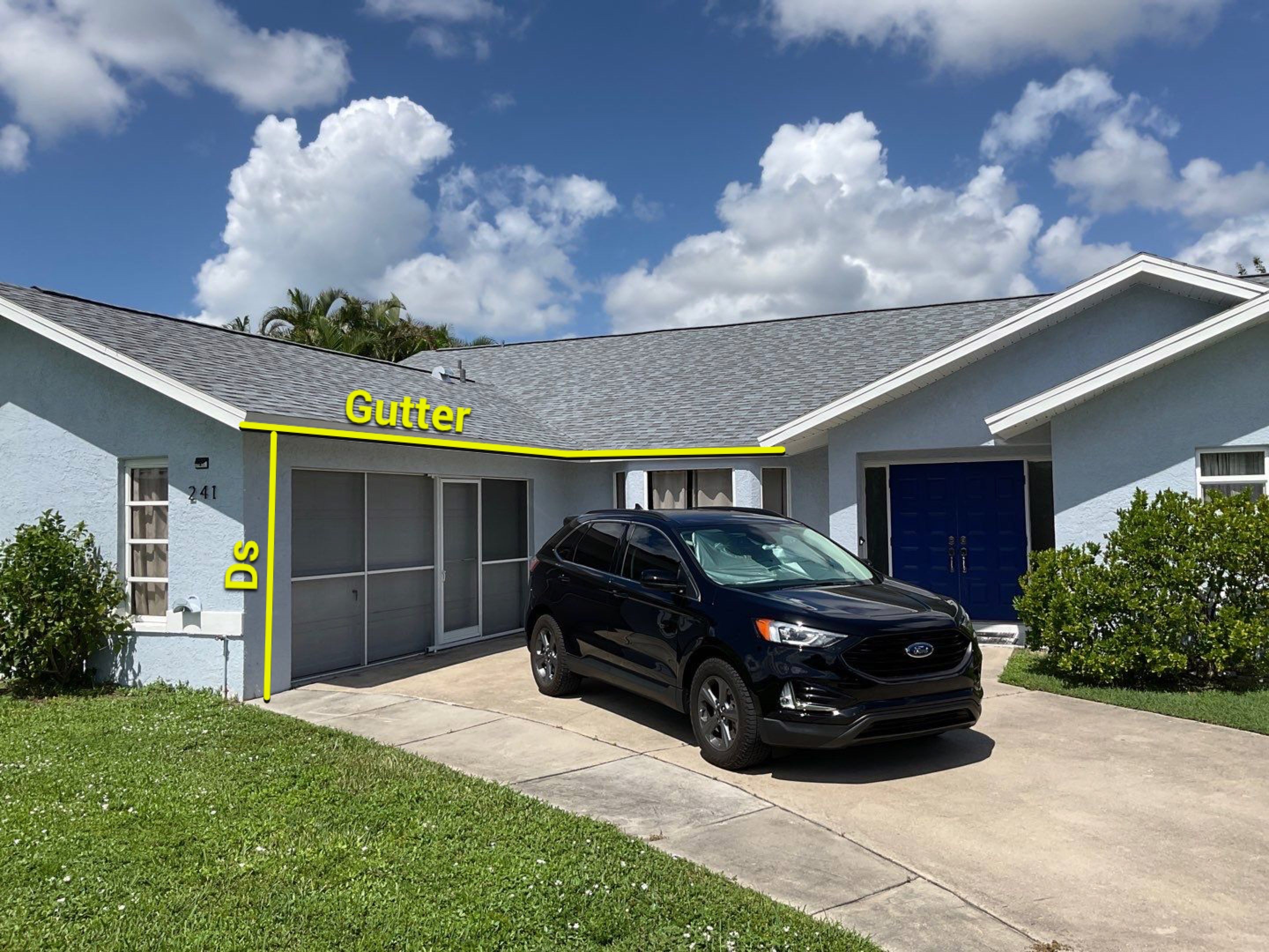 New White Seamless Gutters with Downspouts and Splash Guards in Cape Coral FL by Gutter Professors