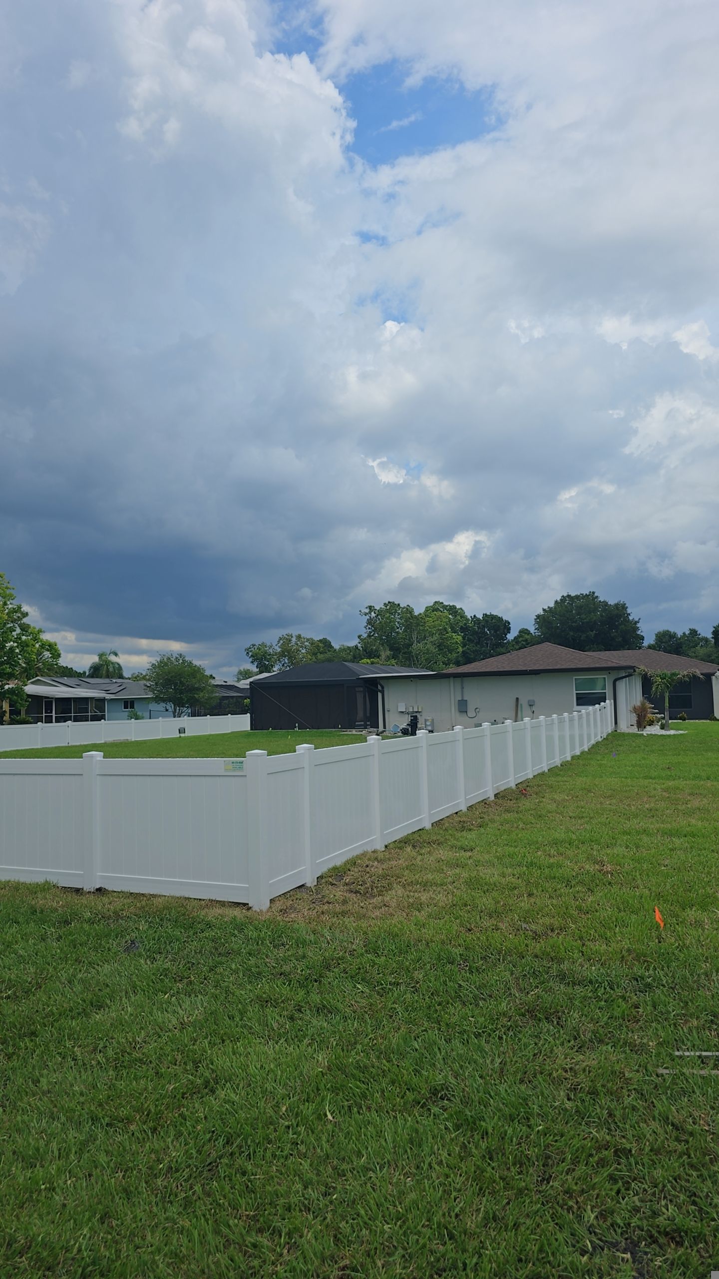 White Vinyl Privacy Fence Installation on Port Charlotte Corner Lot by True Fence LLC
