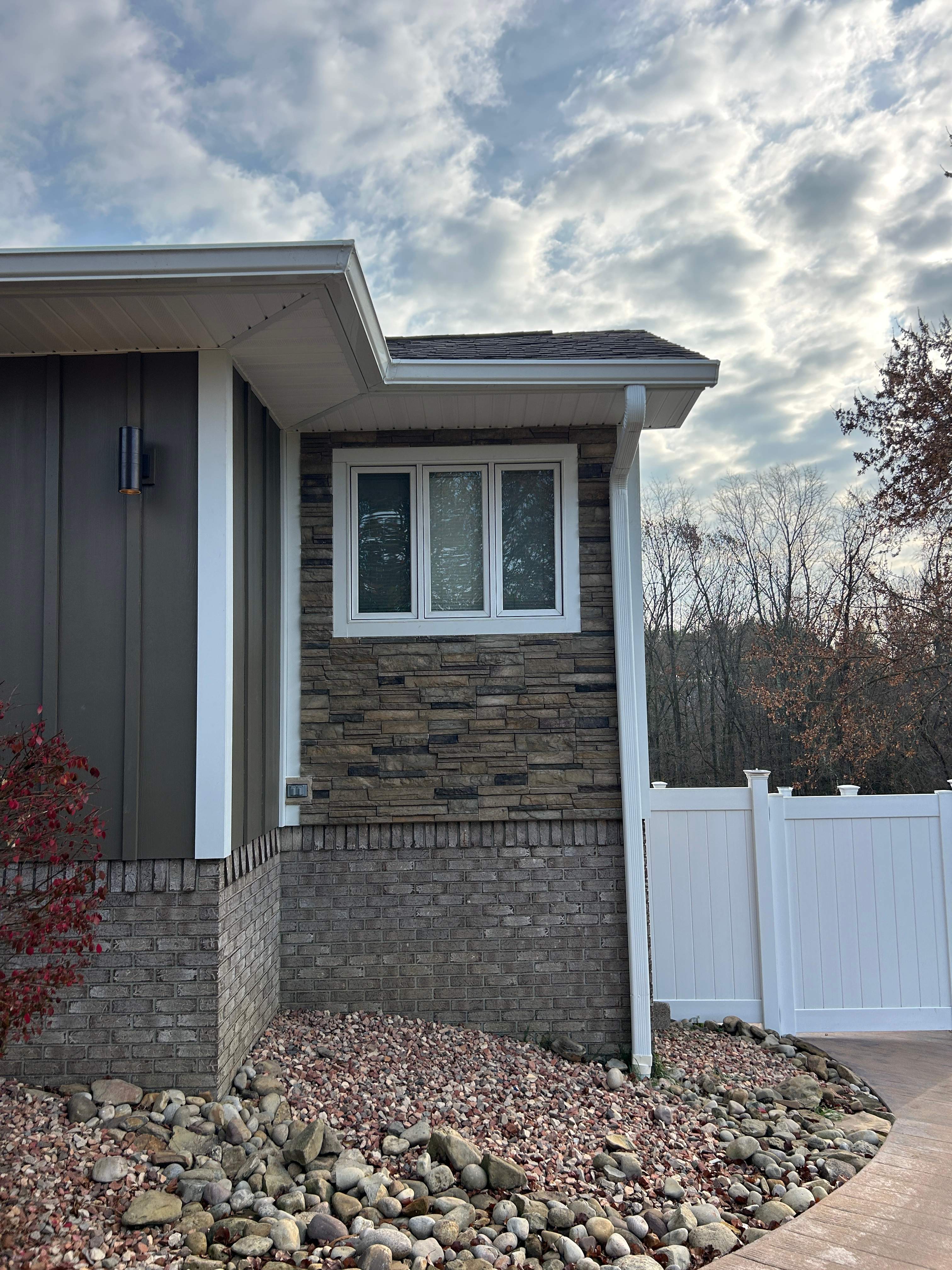 Steubenville Exterior Renovation Featuring Vertical Siding and Stone Accents by Ideal Siding Pittsburgh
