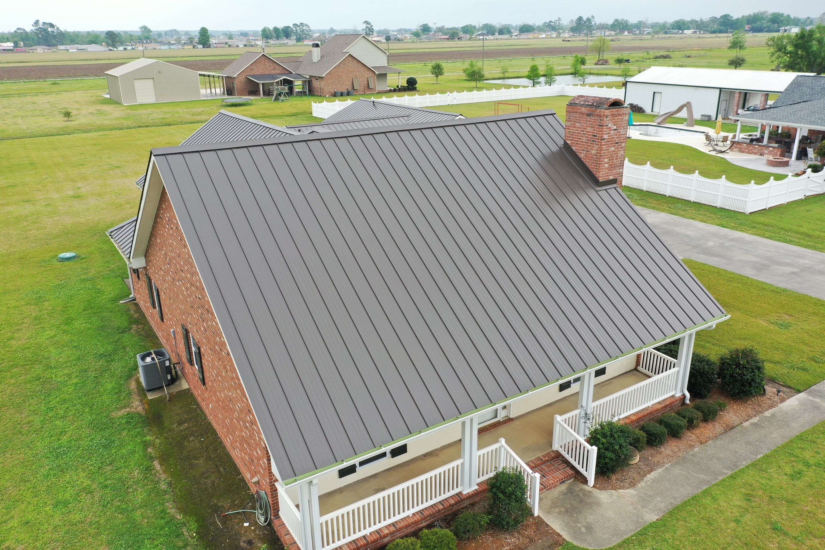 Standing Seam Metal Roof Installation by Top Team Roofing & Construction