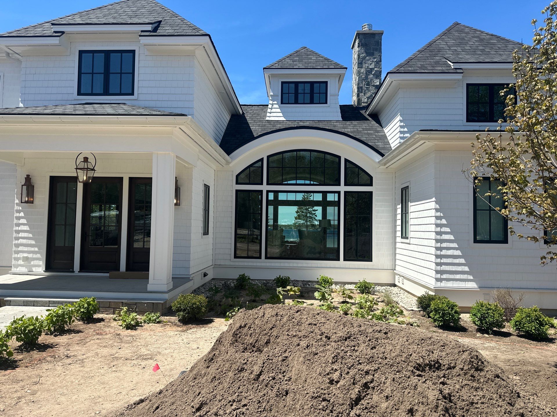 Gutter System and Exterior Drainage Installation in Charlevoix by Rainbow Seamless Systems