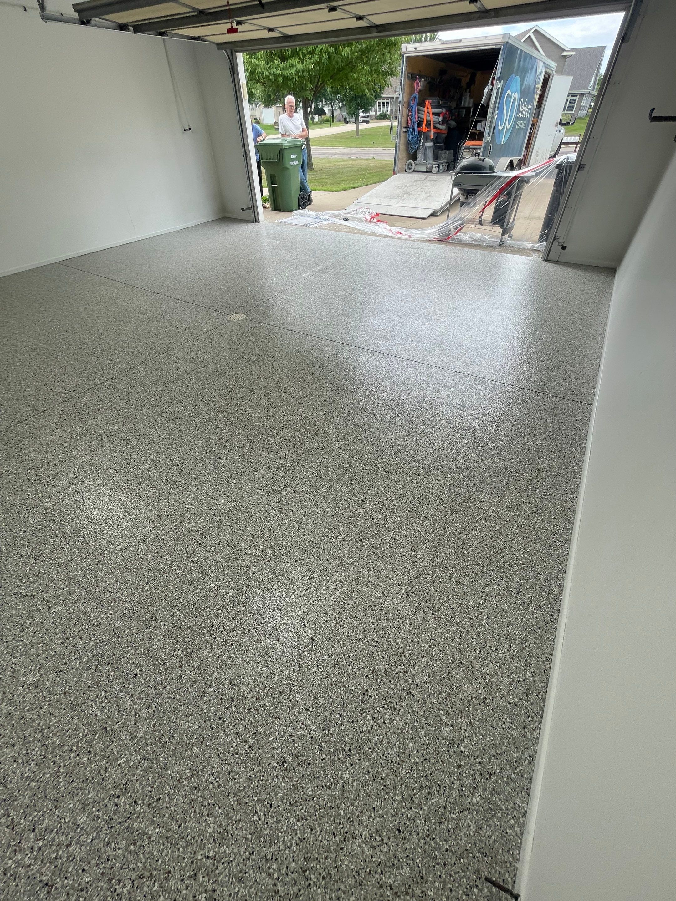 Coyote Flake Garage Floor Coating in Worthington, Minnesota by Select Painting, Coatings & Garage Cabinets