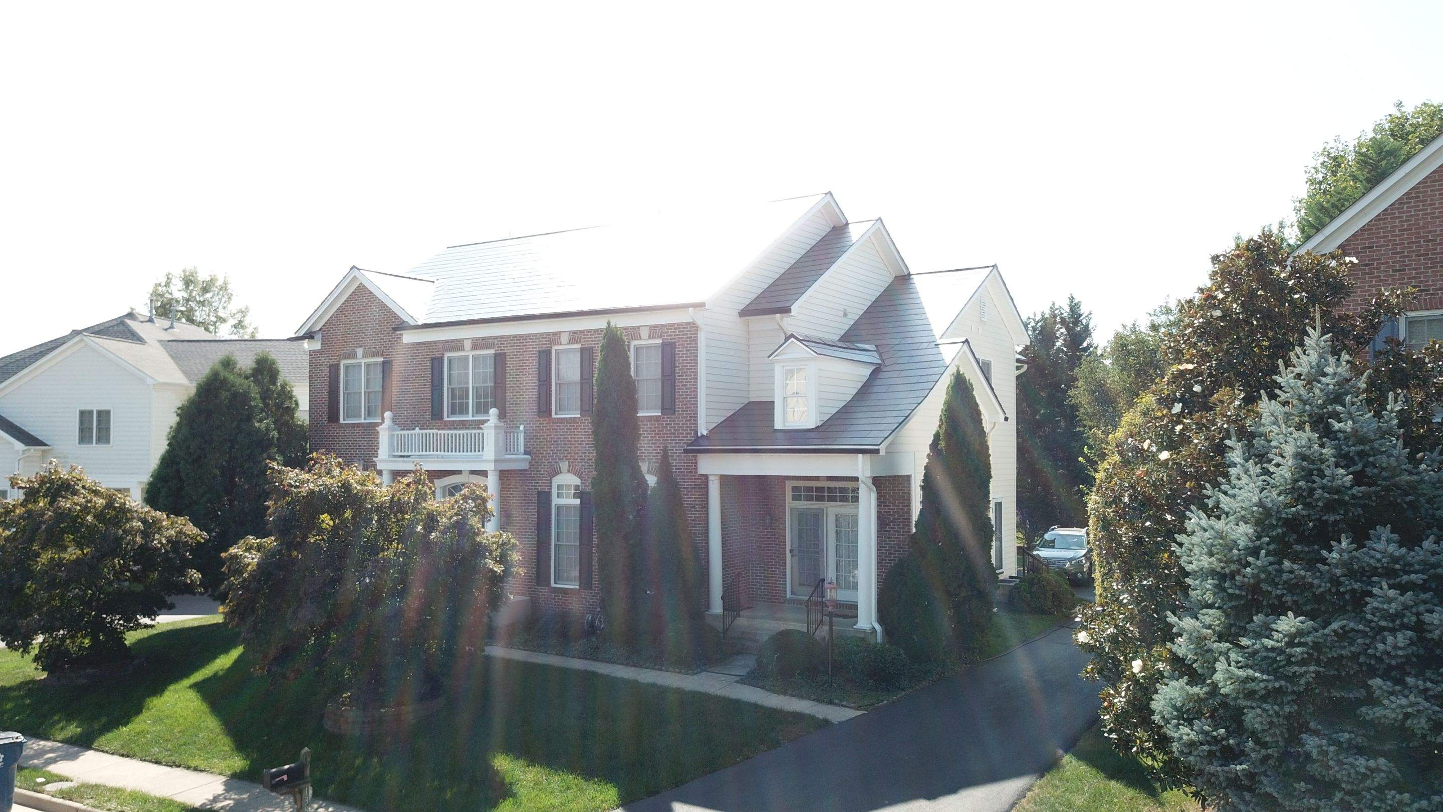 Tesla Solar Roof Replacement using Tesla Solar Roof V3 tiles by American Home Contractors