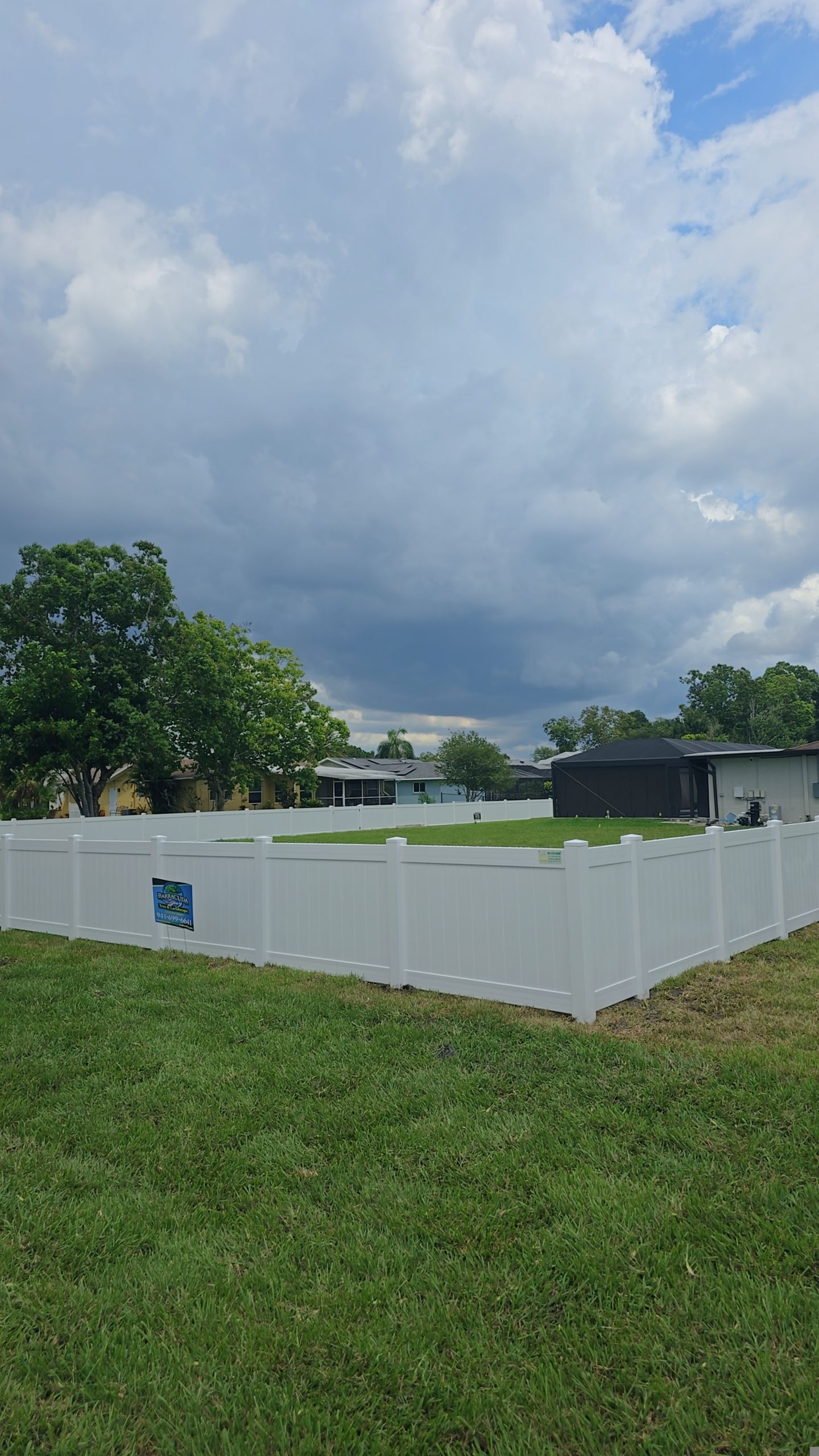 White Vinyl Privacy Fence Installation on Port Charlotte Corner Lot by True Fence LLC