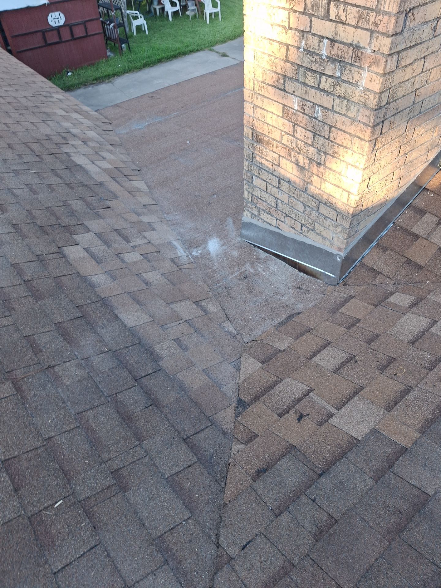 Chimneys need a Cricket.  by Bayfront Roofing and Construction