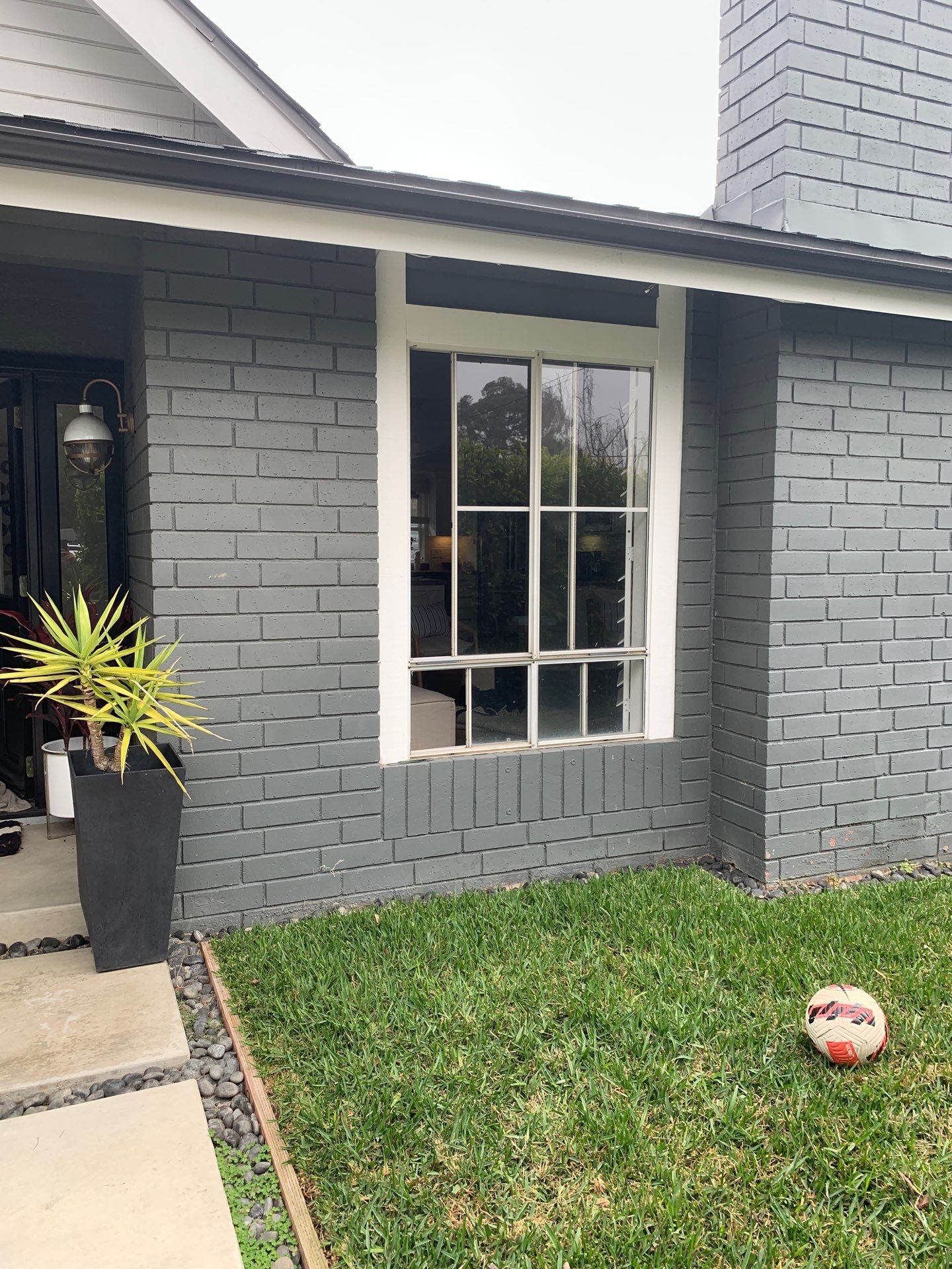 Window Installation using Milgard black vinyl windows by American Window Company