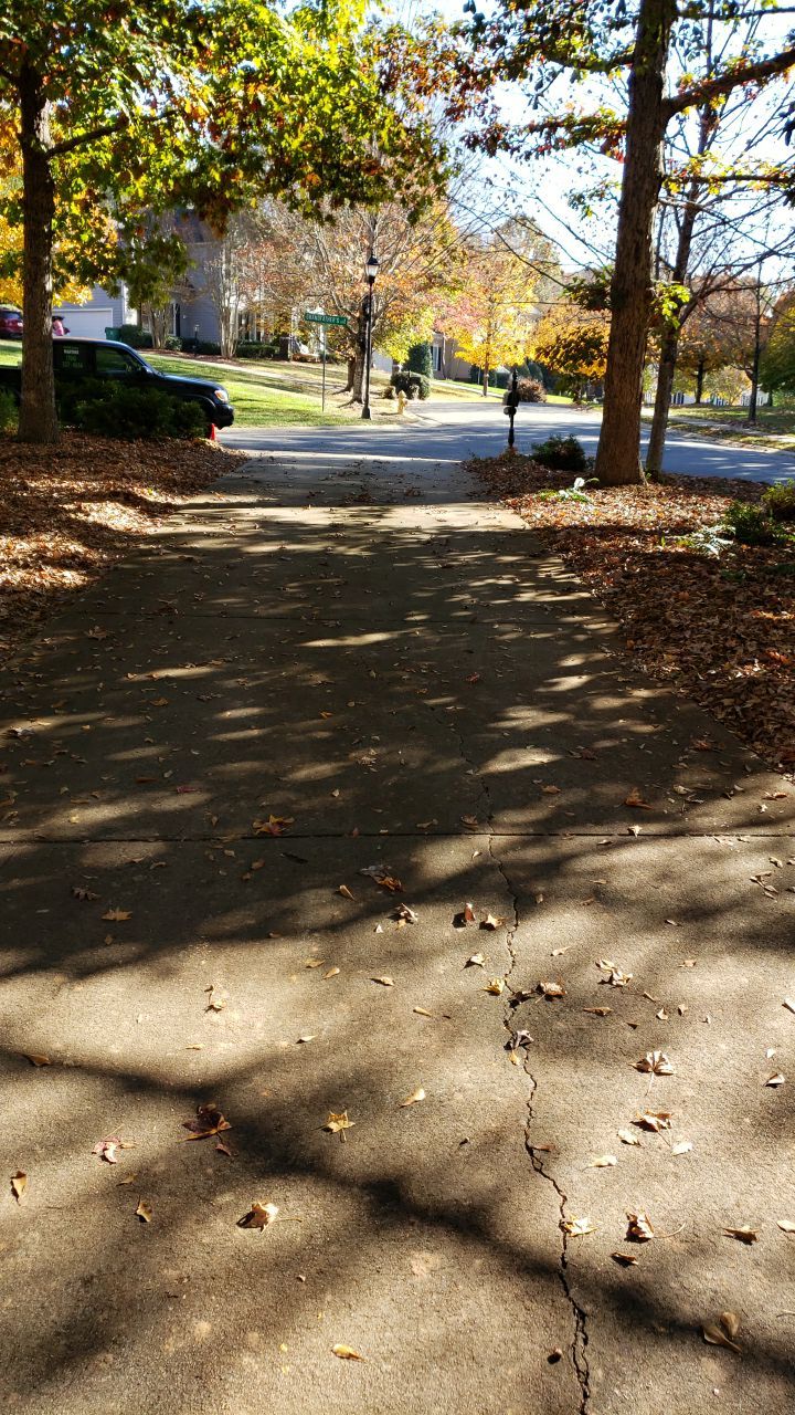 Driveway Clean using cleaner by Power Wash Masters LLC