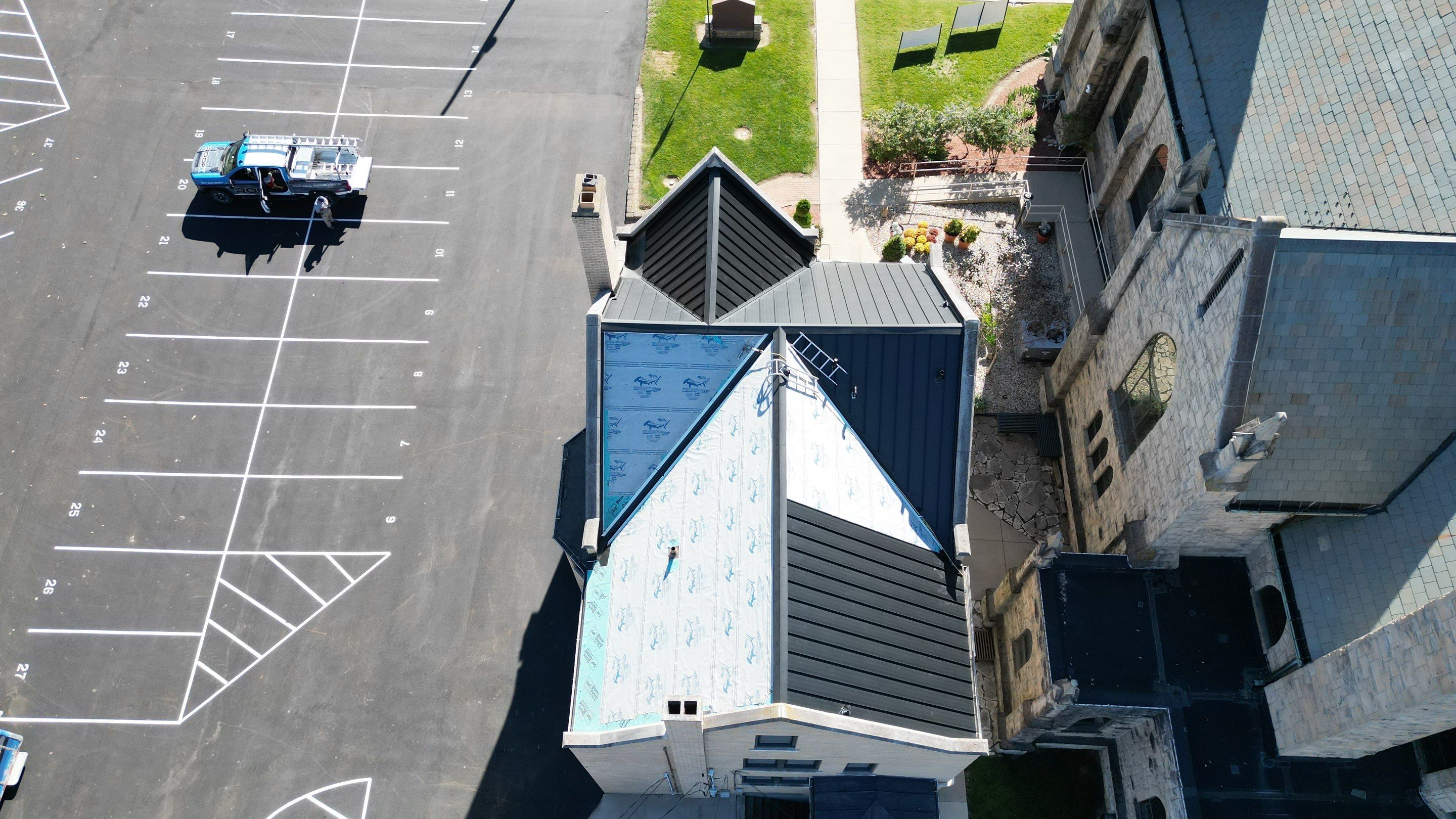Commercial Roofing Installation using Standing Seam Metal - Frost Black by RoofX 