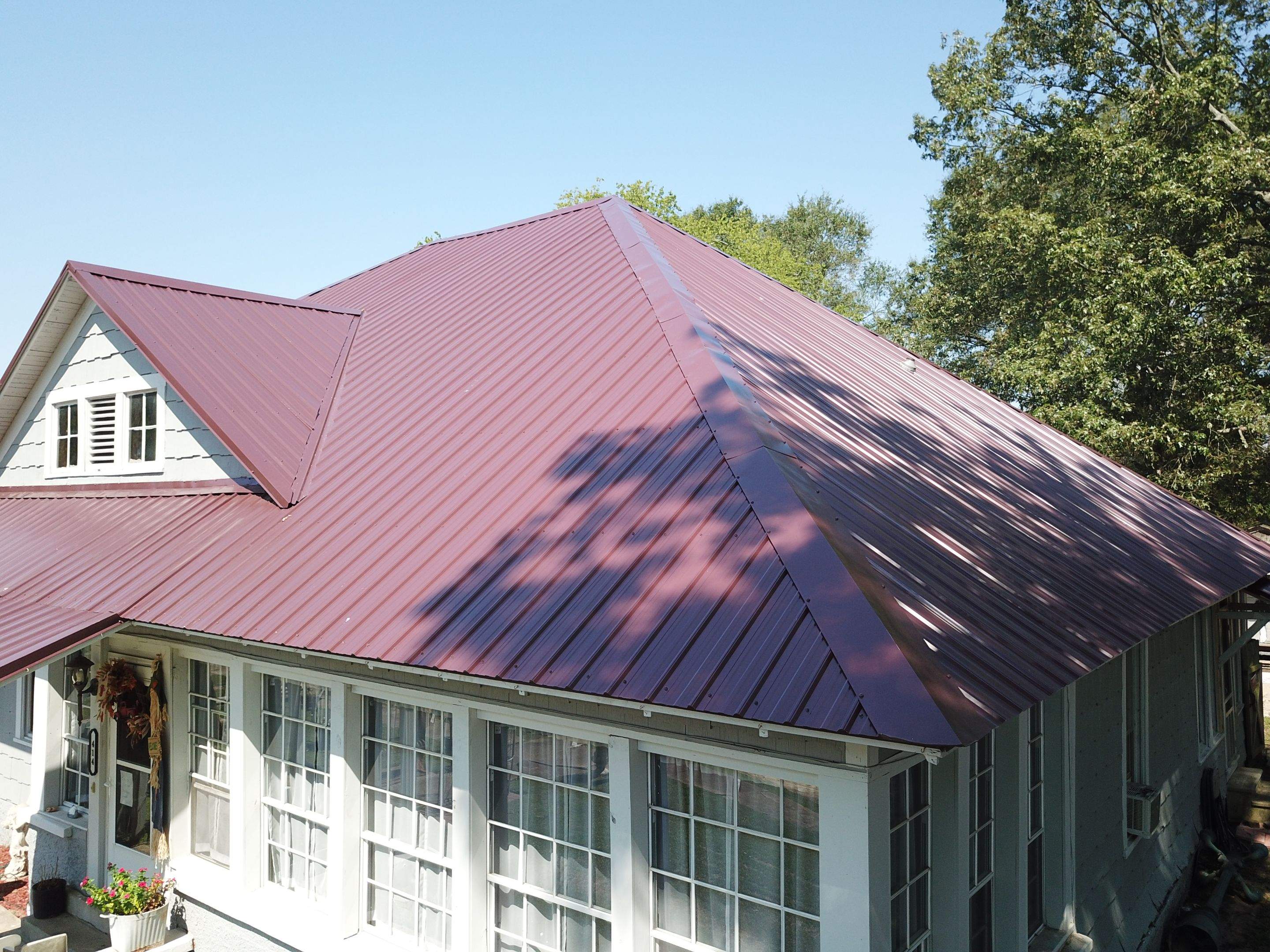 Residential Metal Roof Replacement using Reed's Metals: Colored Residental Panel (Burgundy) by Hostetler Roofing