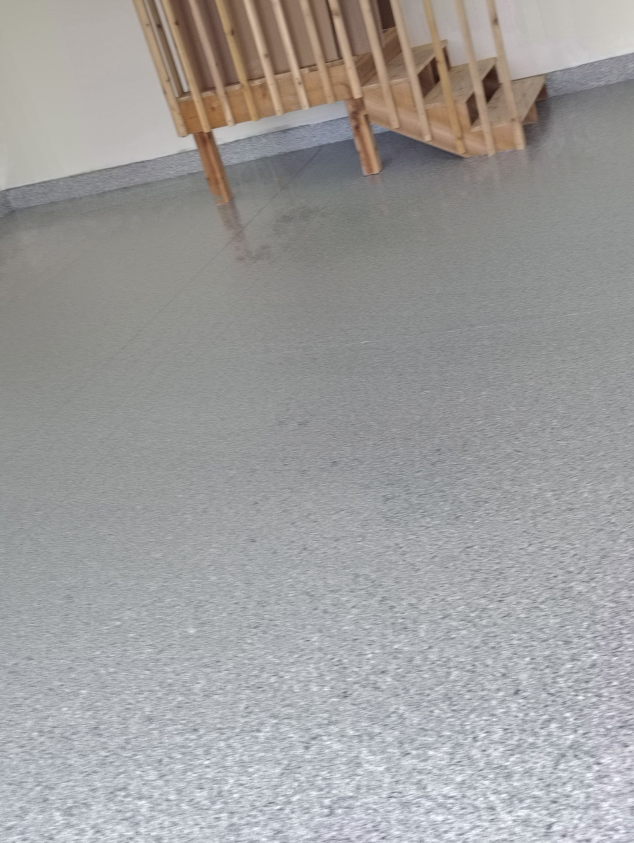 Sioux Falls Garage Floor Transformation with Gray Decorative Flake Coating by Select Painting, Coatings & Garage Cabinets