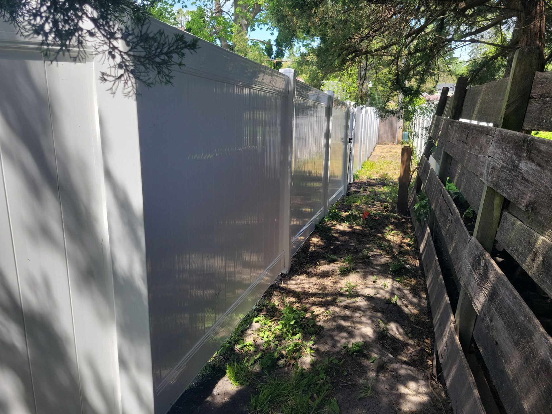 Residential White Vinyl Privacy Fence Installation in Waterloo by Perfect Picket Fence and Stain