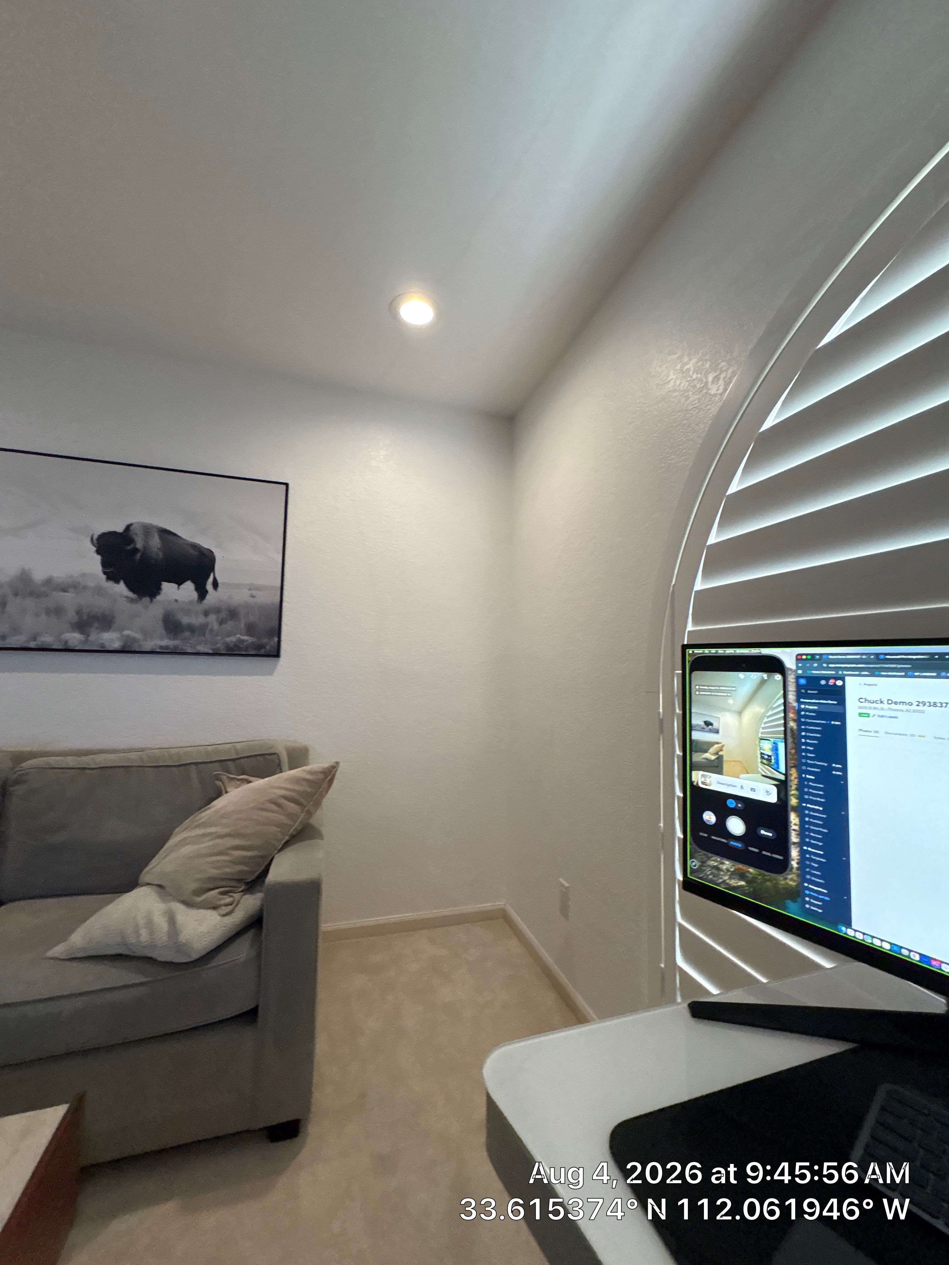 Custom Home Office Setup Featuring Arched Plantation Shutters and Accent Wall by CompanyCam Sales Demo