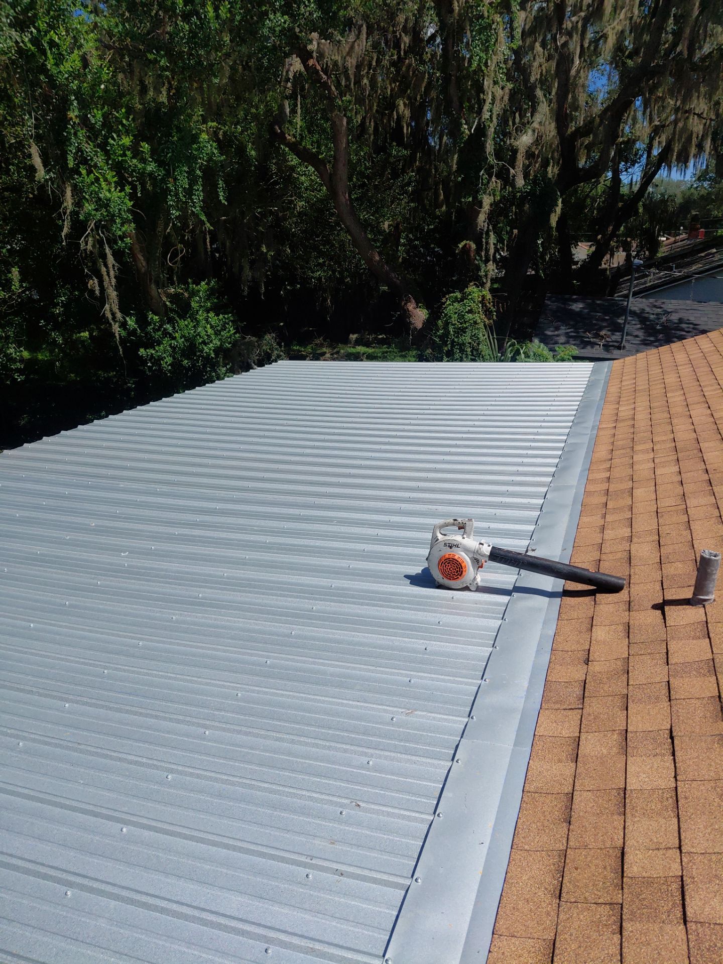 Combined Shingle and Metal Residential Roof Replacement in Leesburg Florida by Pinnacle Roofing Group