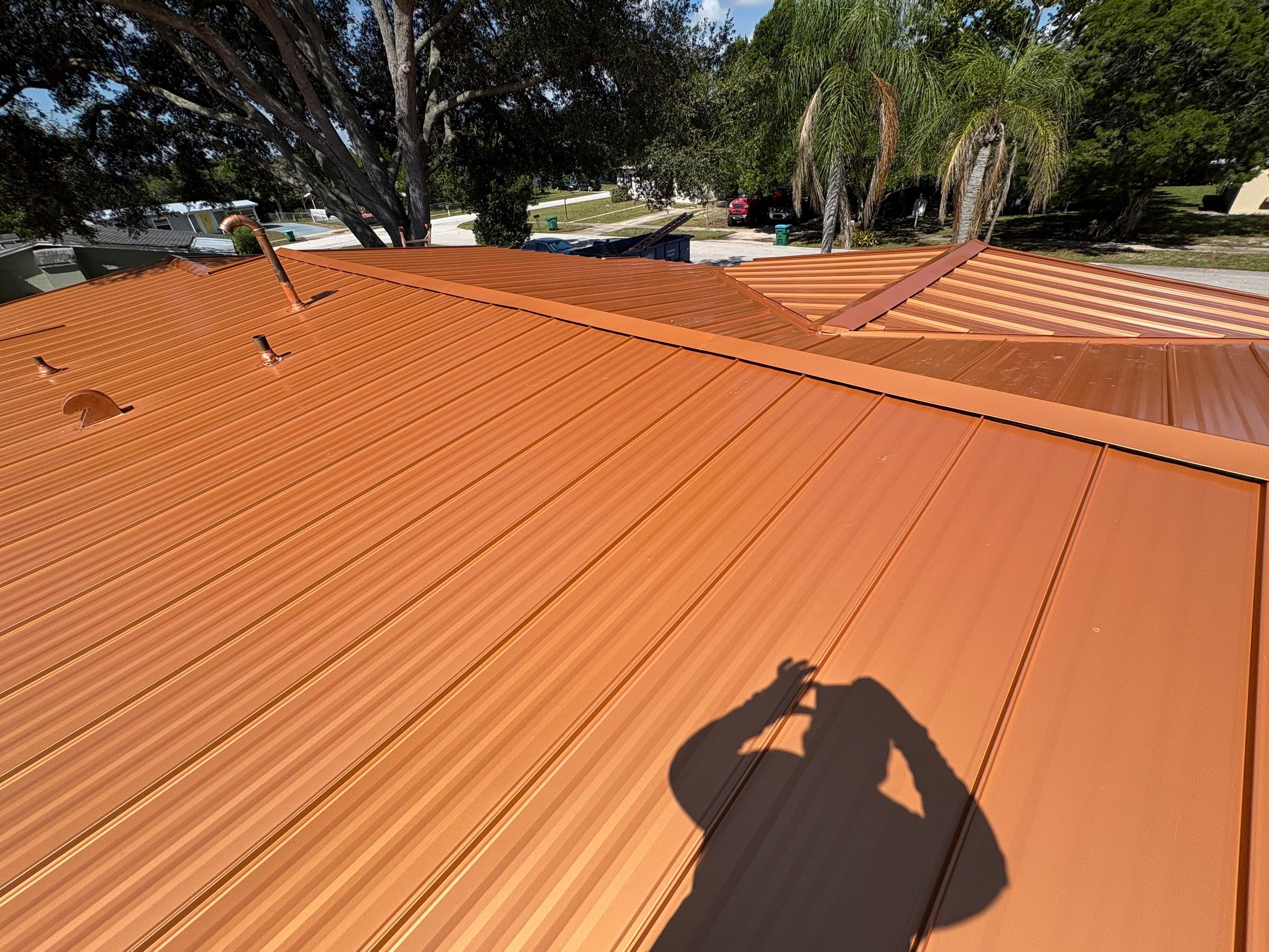 Standing Seam Metallic Copper Metal Roof Replacement in Deltona by Pinnacle Roofing Group