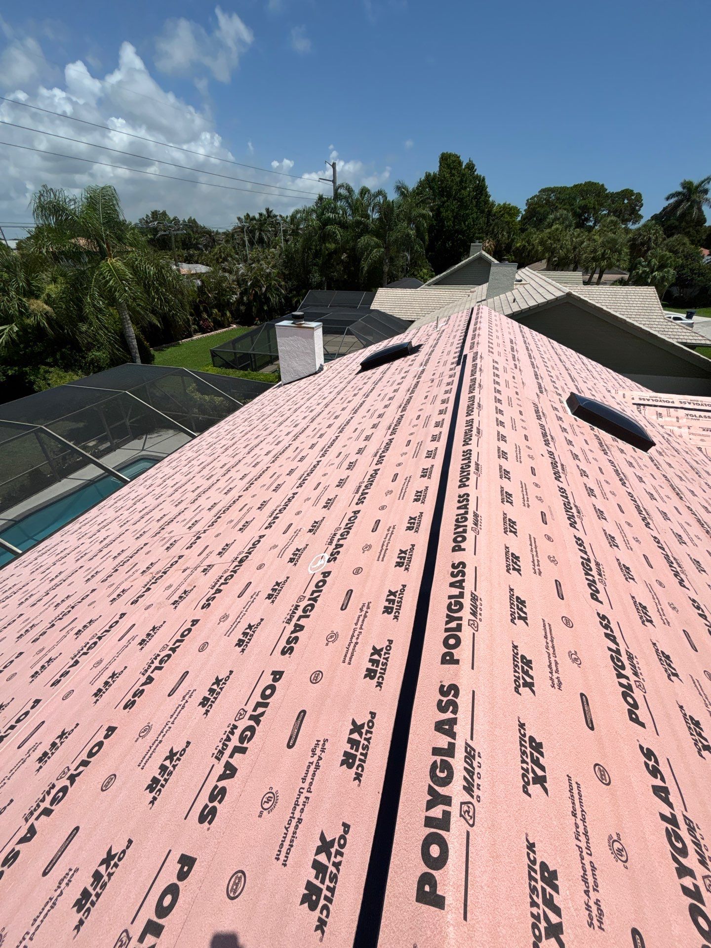 Standing Seam Metal Charcoal Grey Roof Replacement and Skylight Installation in Jupiter by Art's Roofing & Construction