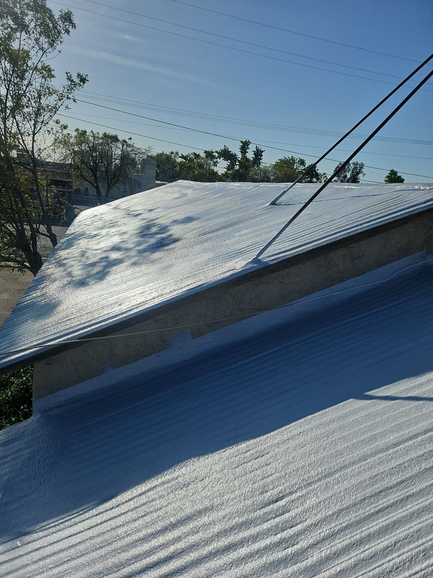Spray foam and coatings using Conklin Benchmark/PUMA XL by Straight Edge Roofing Inc