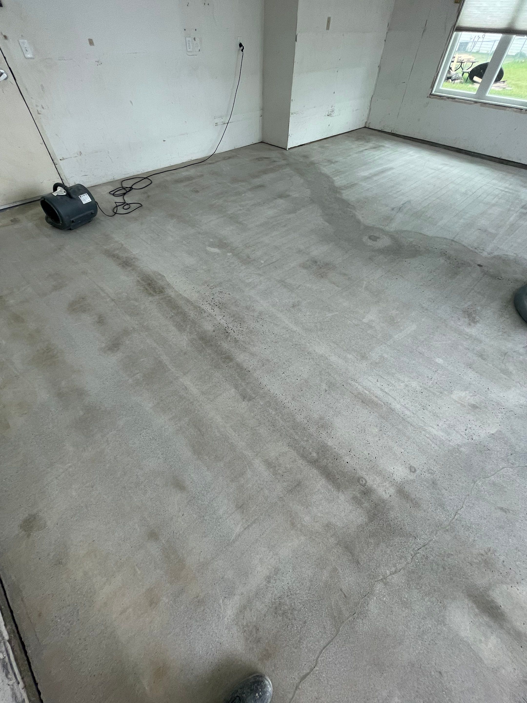 Coyote Flake Concrete Coating for Sioux Falls Garage by Select Painting, Coatings & Garage Cabinets