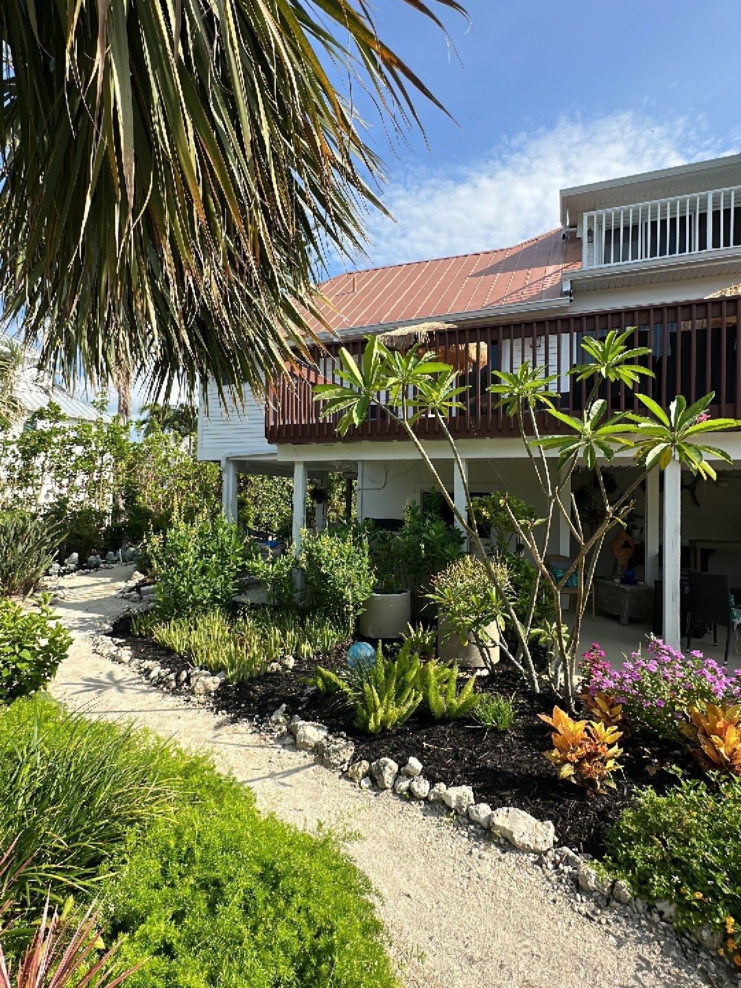 White K-Style Gutters Installed with White Downspouts in Sanibel FL by Gutter Professors
