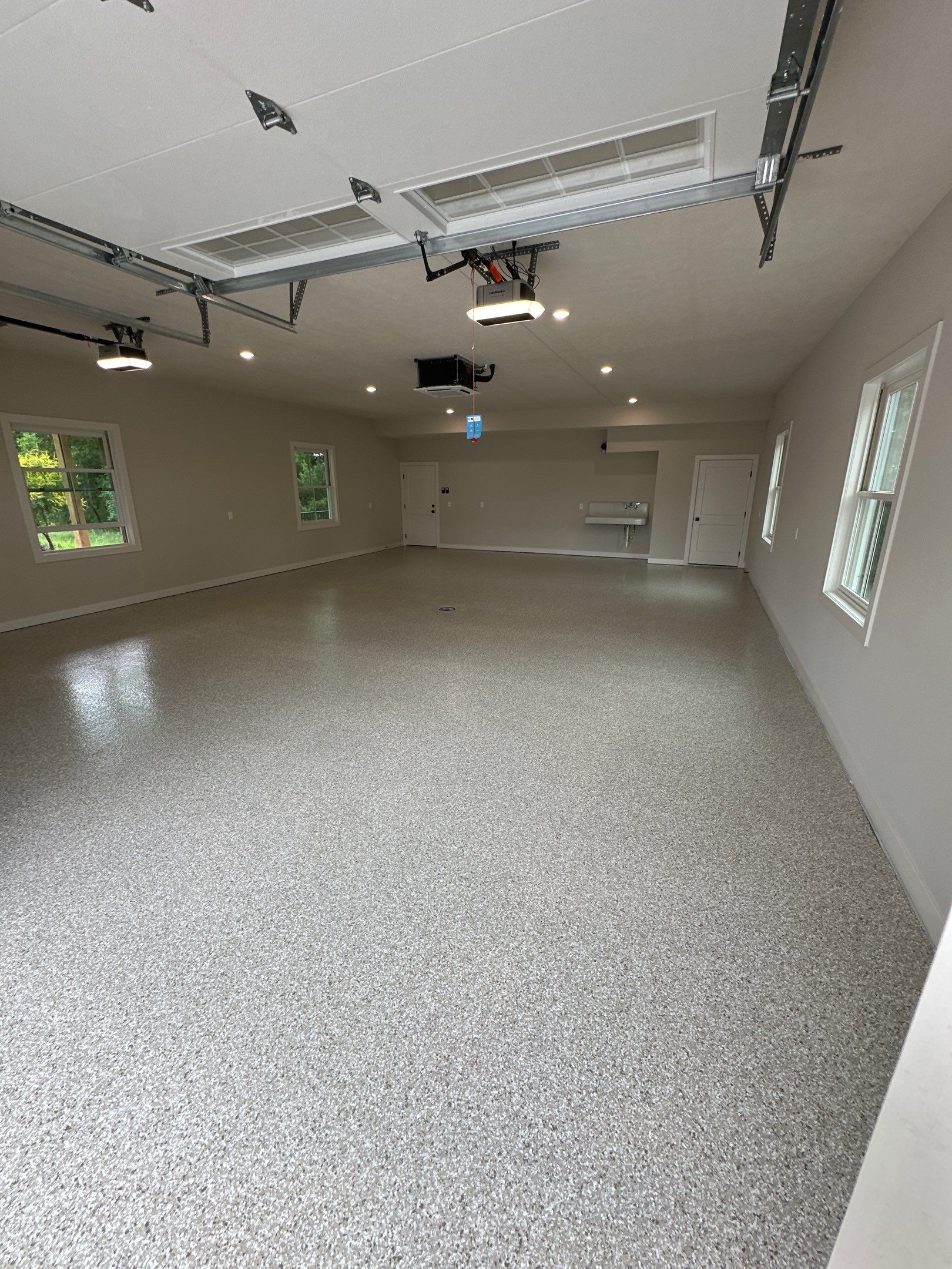 Trail Mix Epoxy Garage / Even Space by Goat Coatings