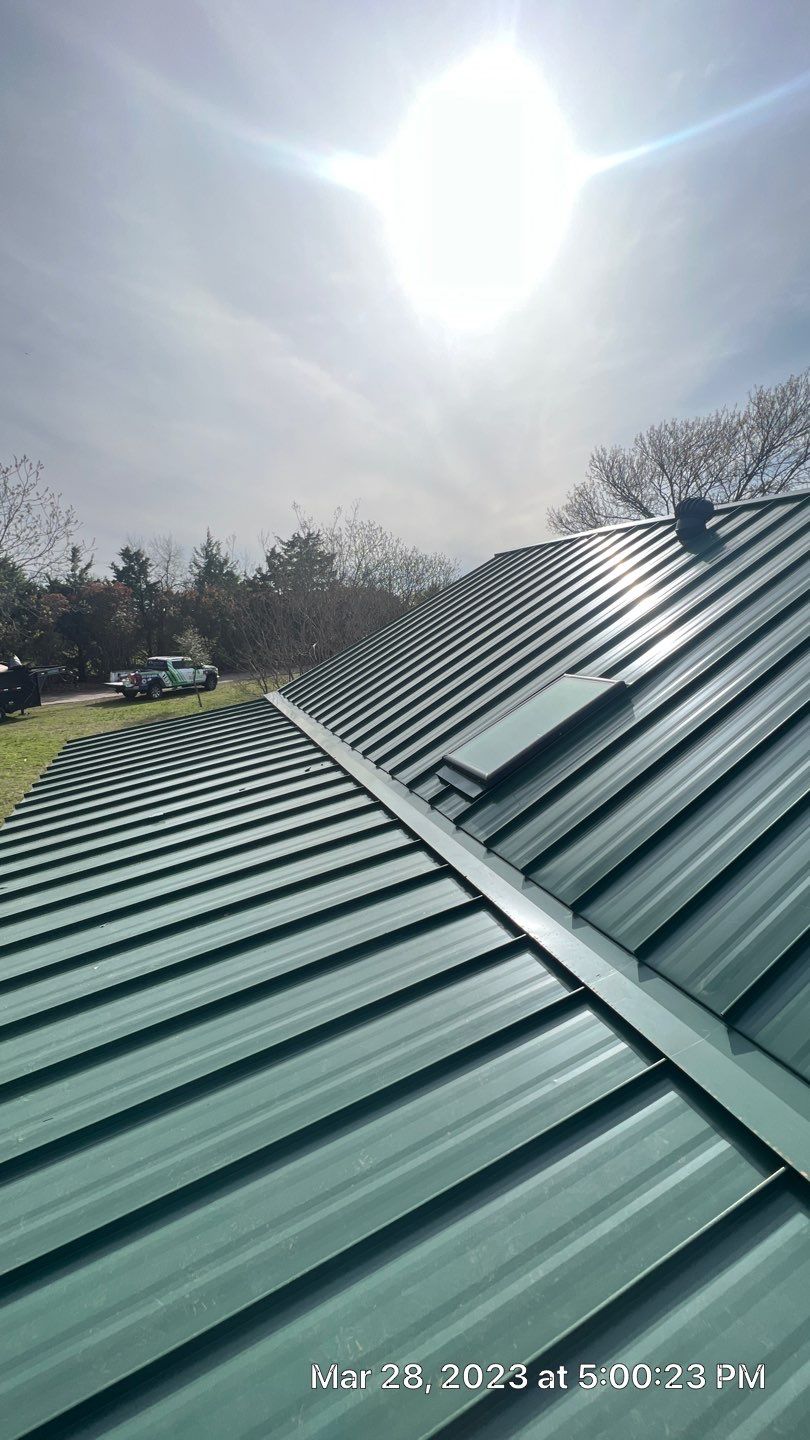 Shingle to Standing Seam Metal Roof by Springtree Restoration 