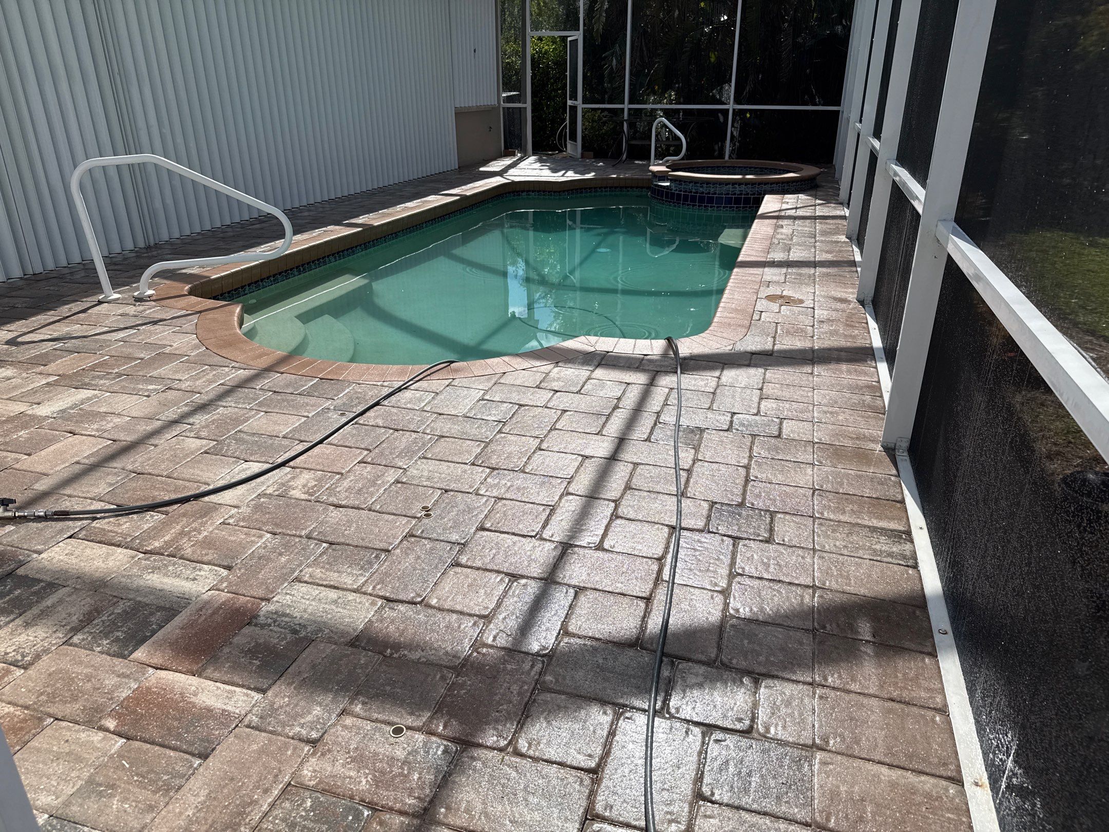 Paver Pool Deck & Screen Enclosure Transformation | University Park, Sarasota FL by Sunshine AquaWash