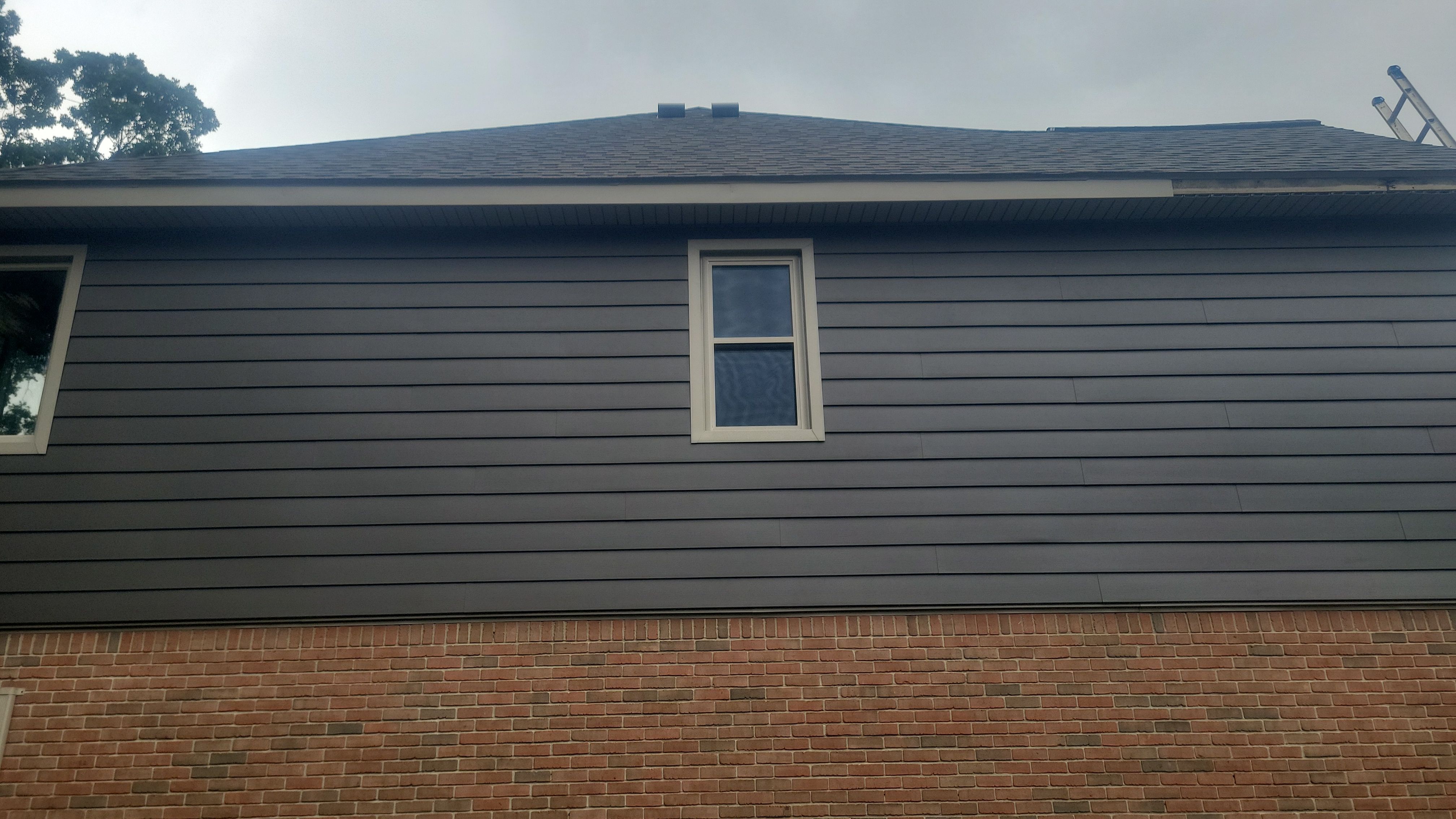 Roof Replacement using Owens Corning Peppercorn and Siding Replacement using Ascend Charcoal Smoke by 180 Contractors