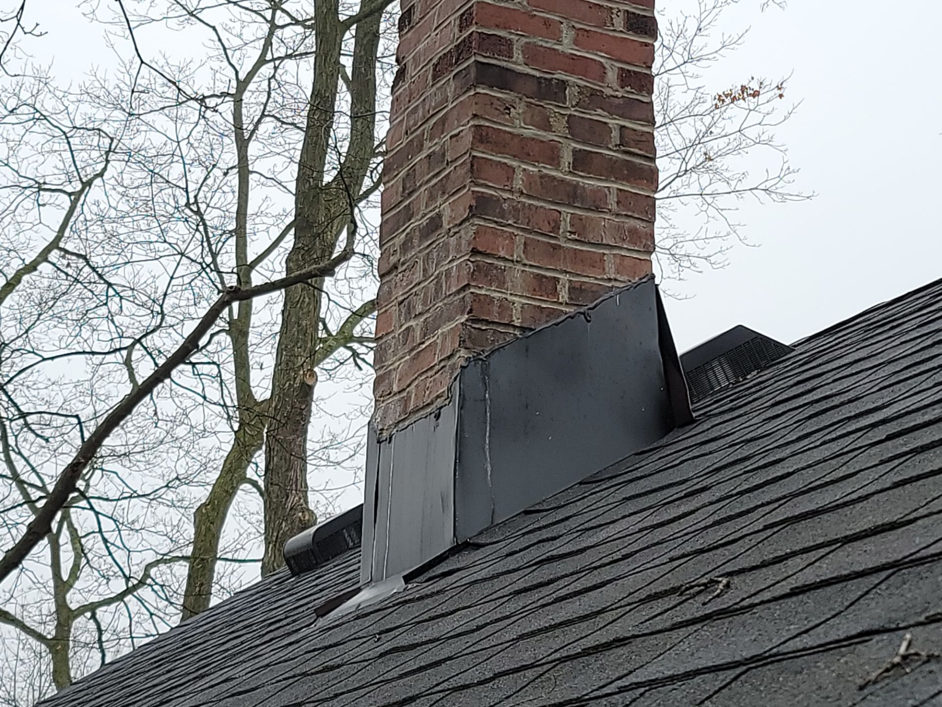 Flat Roof Installation and Chimney Counterflashing Installation by Eagle Eye Roofing