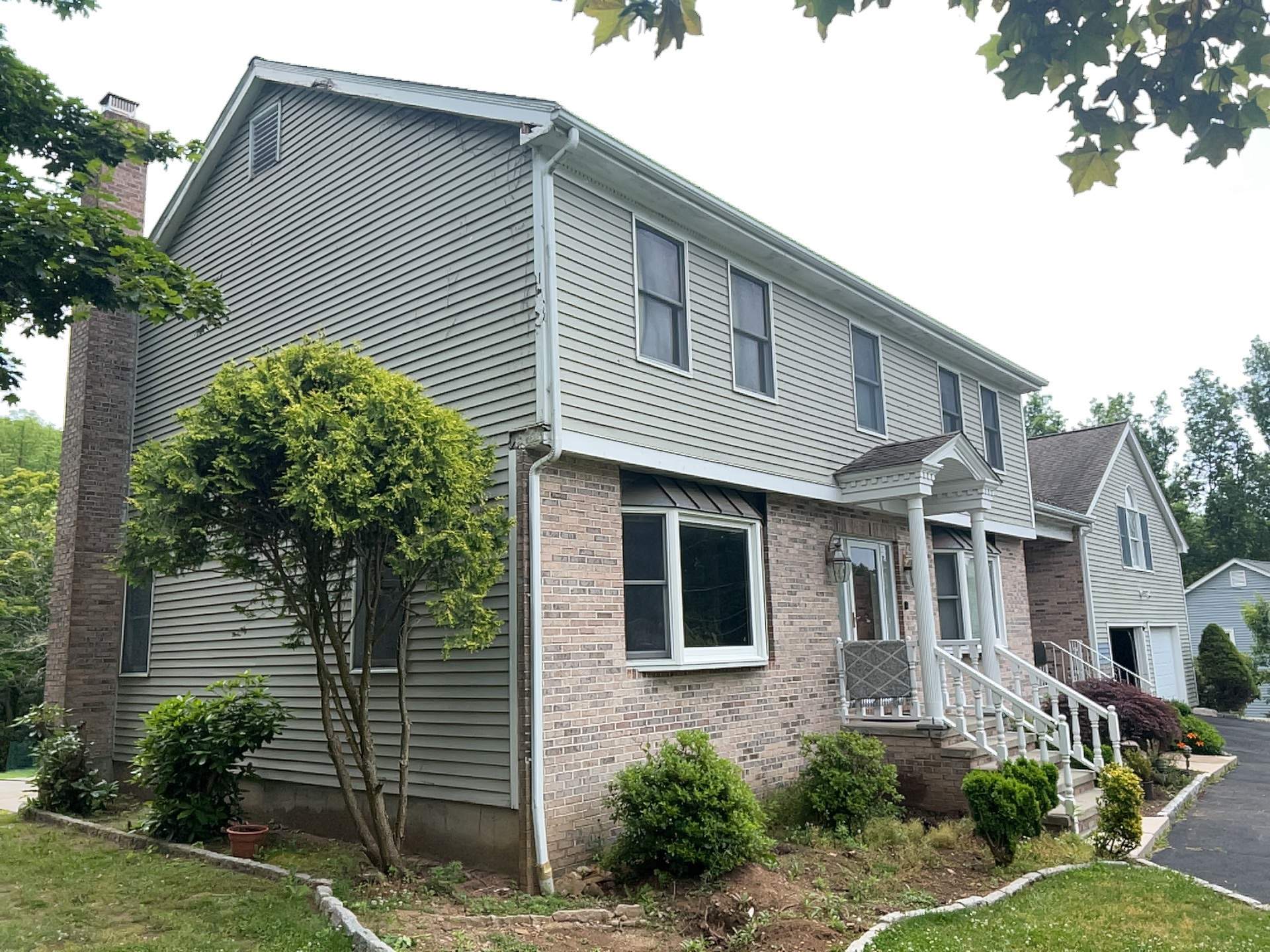 Siding Installation using Mainstreet Colonial & White gutters by A Plus Exterior