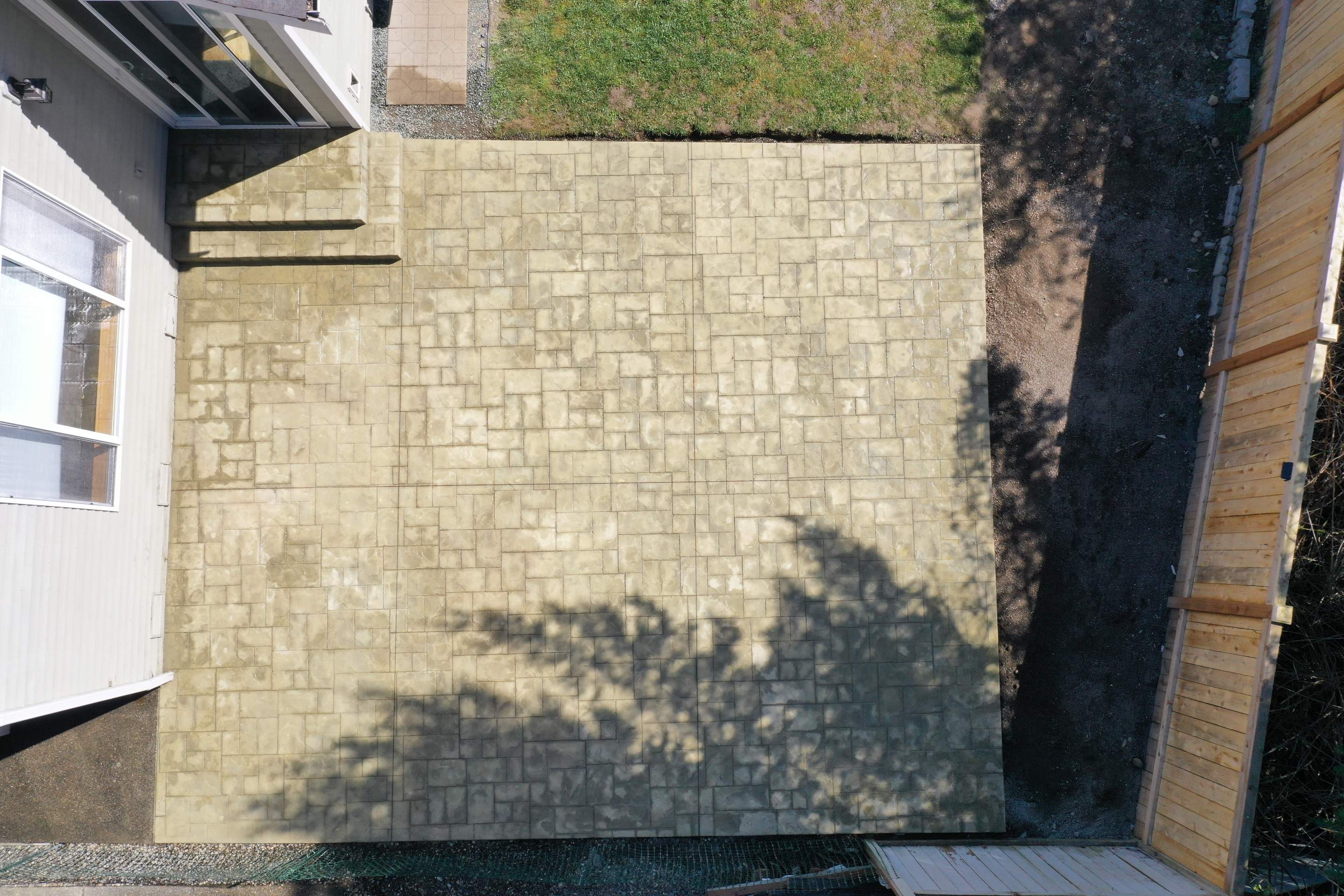 Benedict | Stamped Concrete Back Patio by Jireh Asphalt & Concrete Inc 