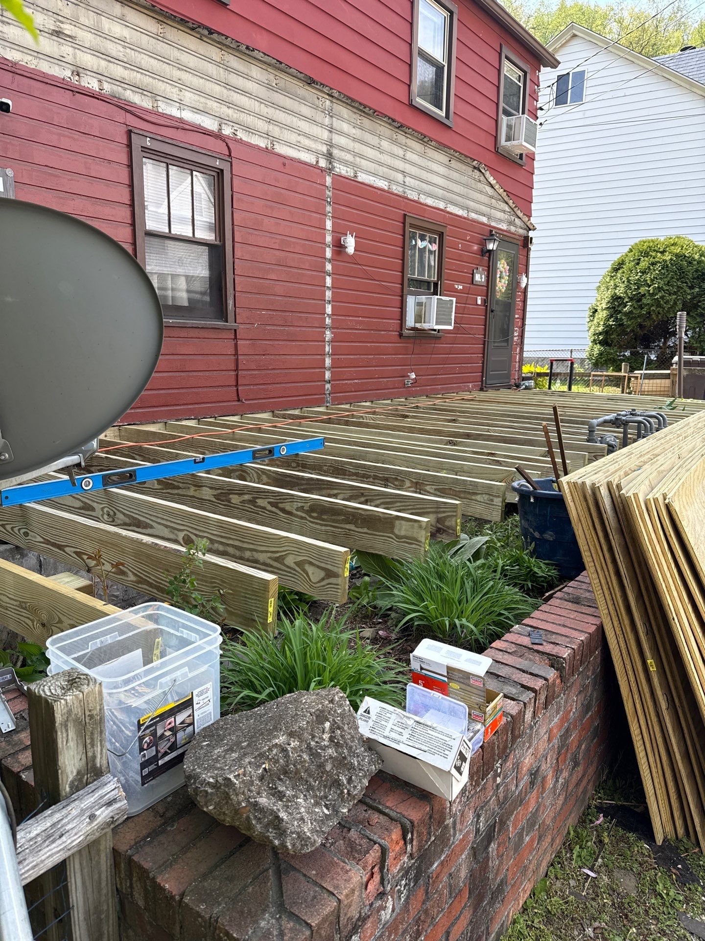 Roof sunspace deck  by Cousins Roofing Siding & Decks