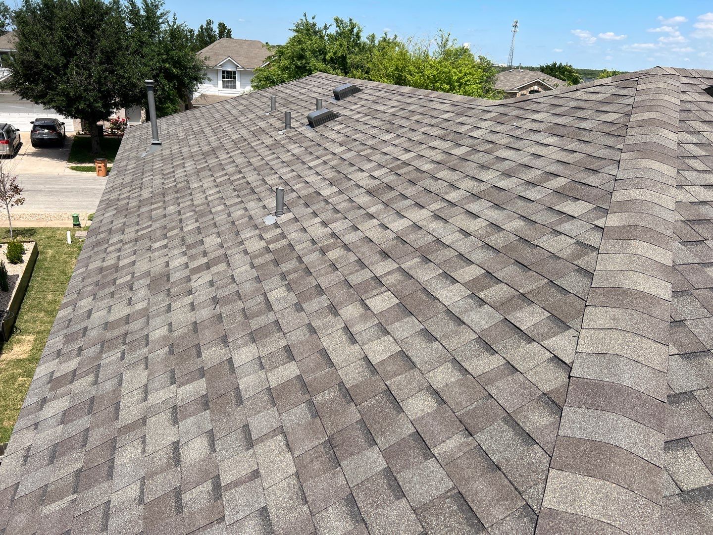 Wind damaged roof replacement by Oakwood Roofing and Construction, LLC