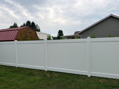 White Vinyl Privacy Fence and Double Gate Installation in Jesup