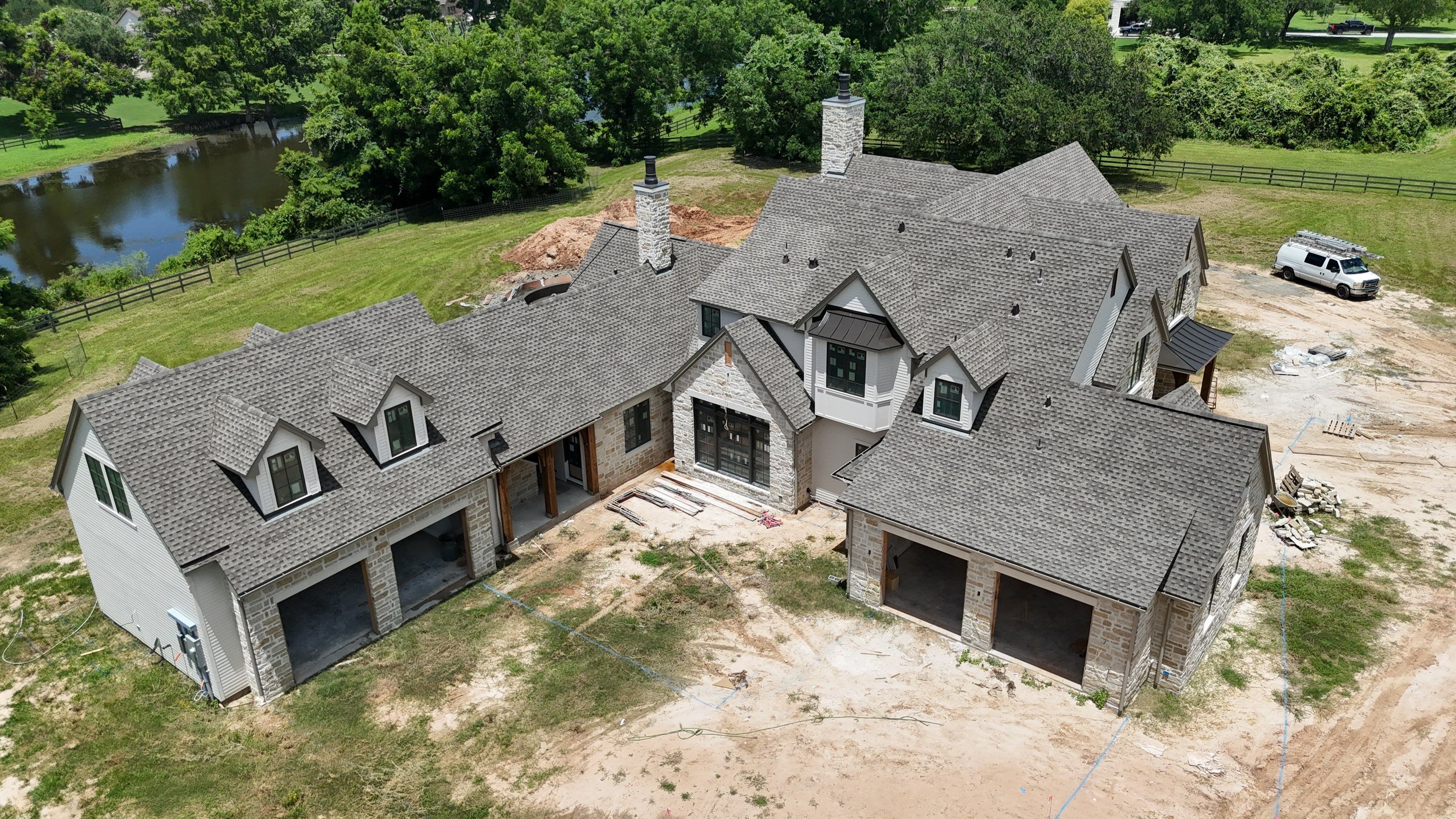 Custom home roof in Fulbrook by Level 7 Companies