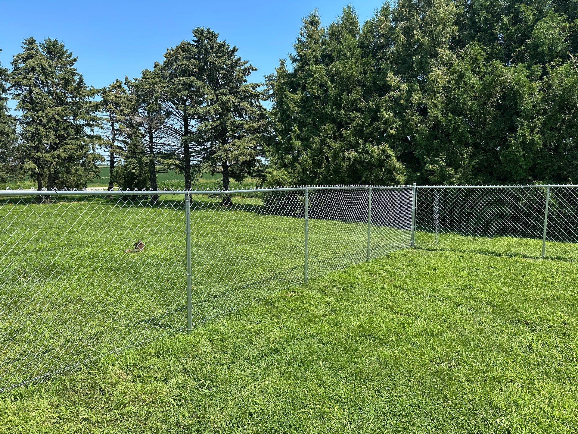 Residential Galvanized Chain Link Perimeter Fence Installation in New Hartford by Perfect Picket Fence and Stain