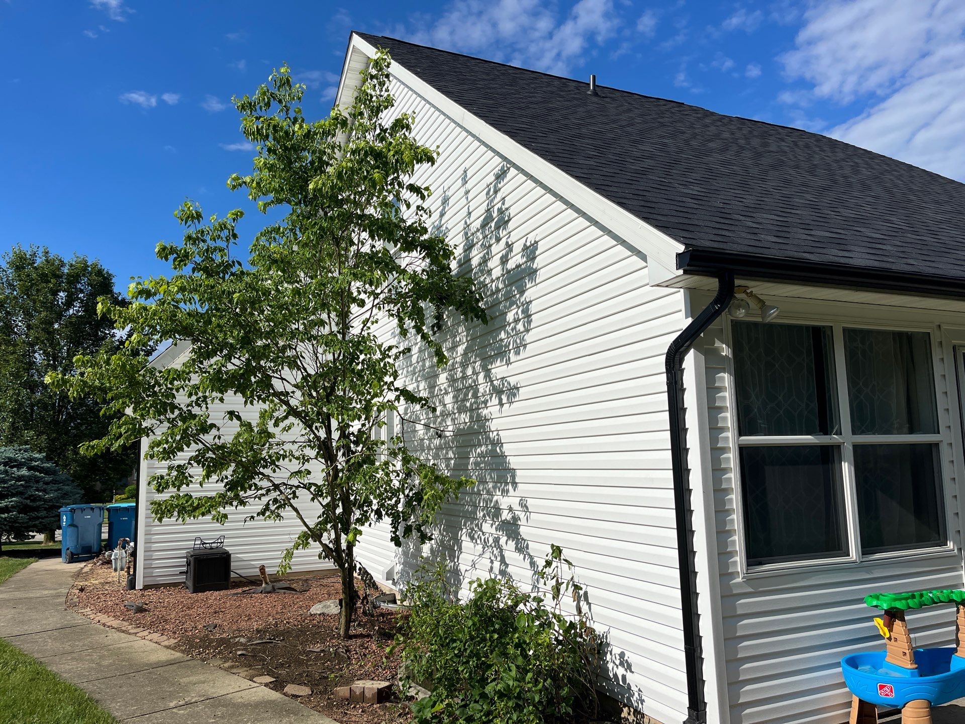 Exterior Installation using Onyx Black Durations and White Siding by WIW Enterprises Inc
