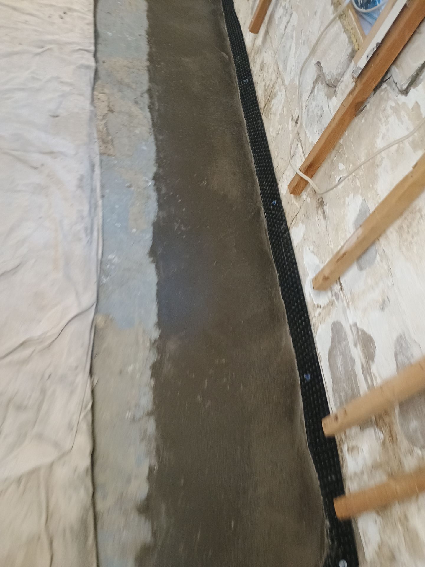 Interior Drain Tile Installation in South Minneapolis by Waterproofing Northeast