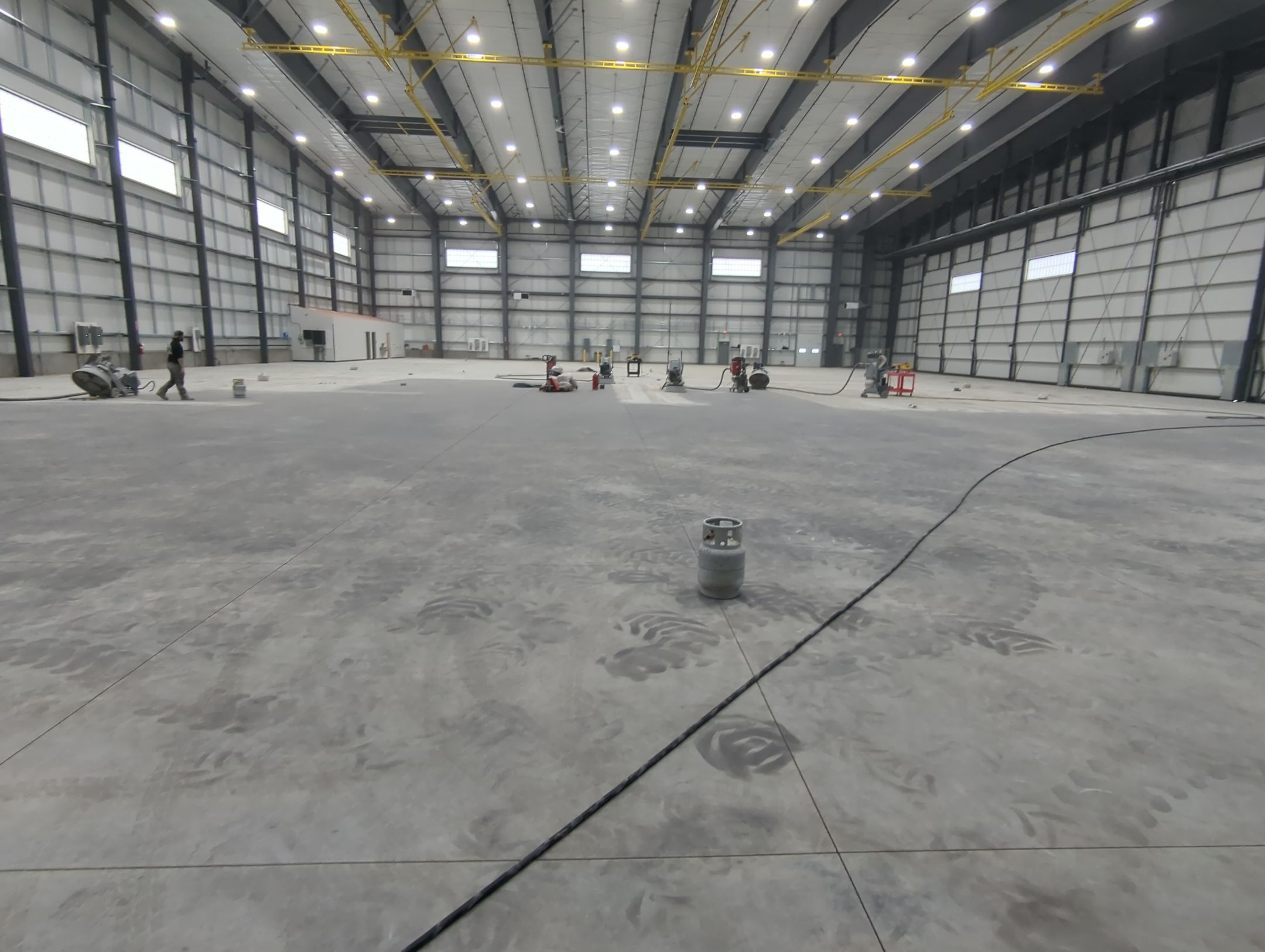 Airplane Hanger using Light Grey Commercial Penntek Epoxy by Croc Coatings, LLC