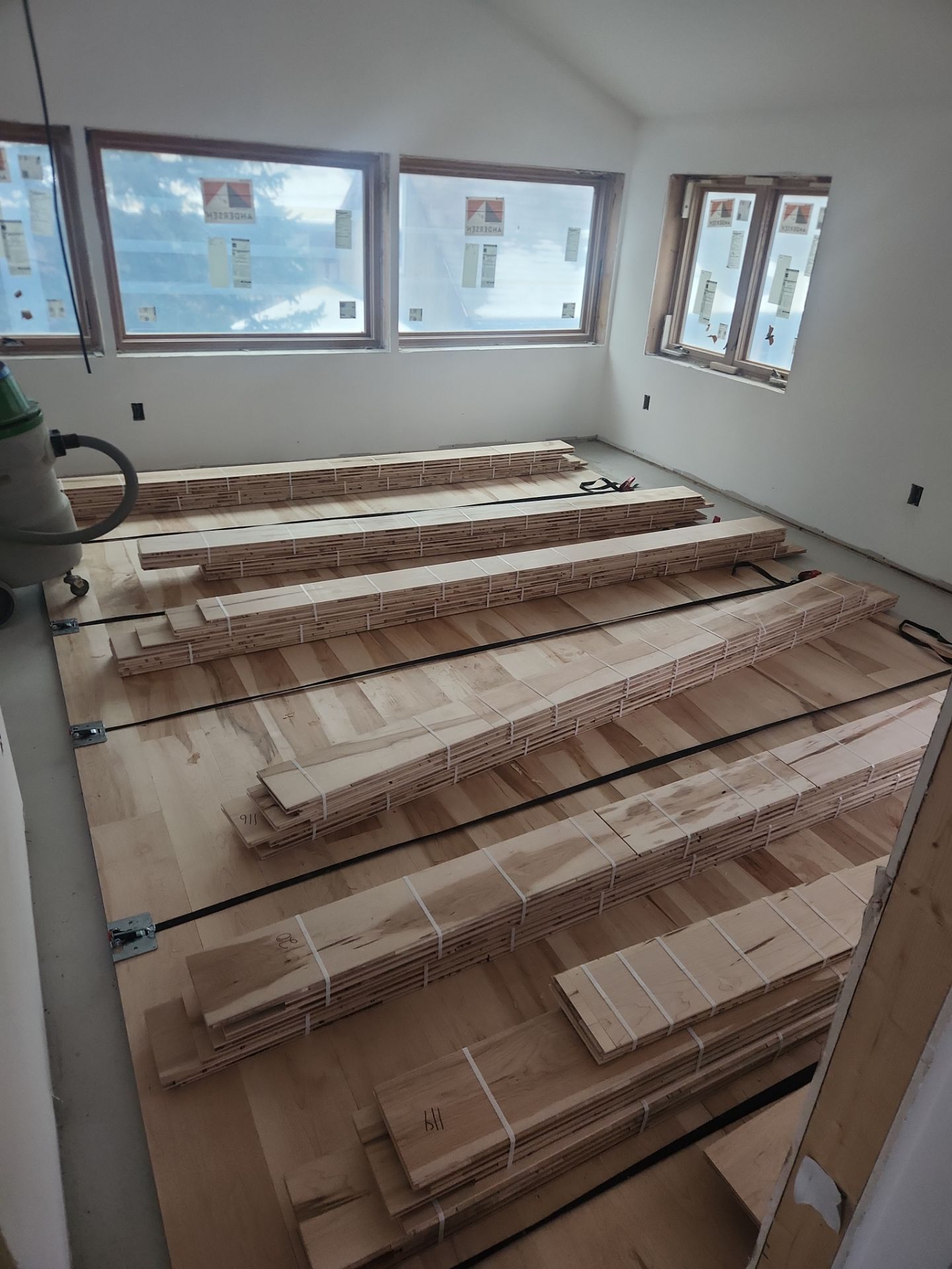 Full glue down Installation over radiant heat 7" Maple character grade by Ann Arbor Hardwoods 