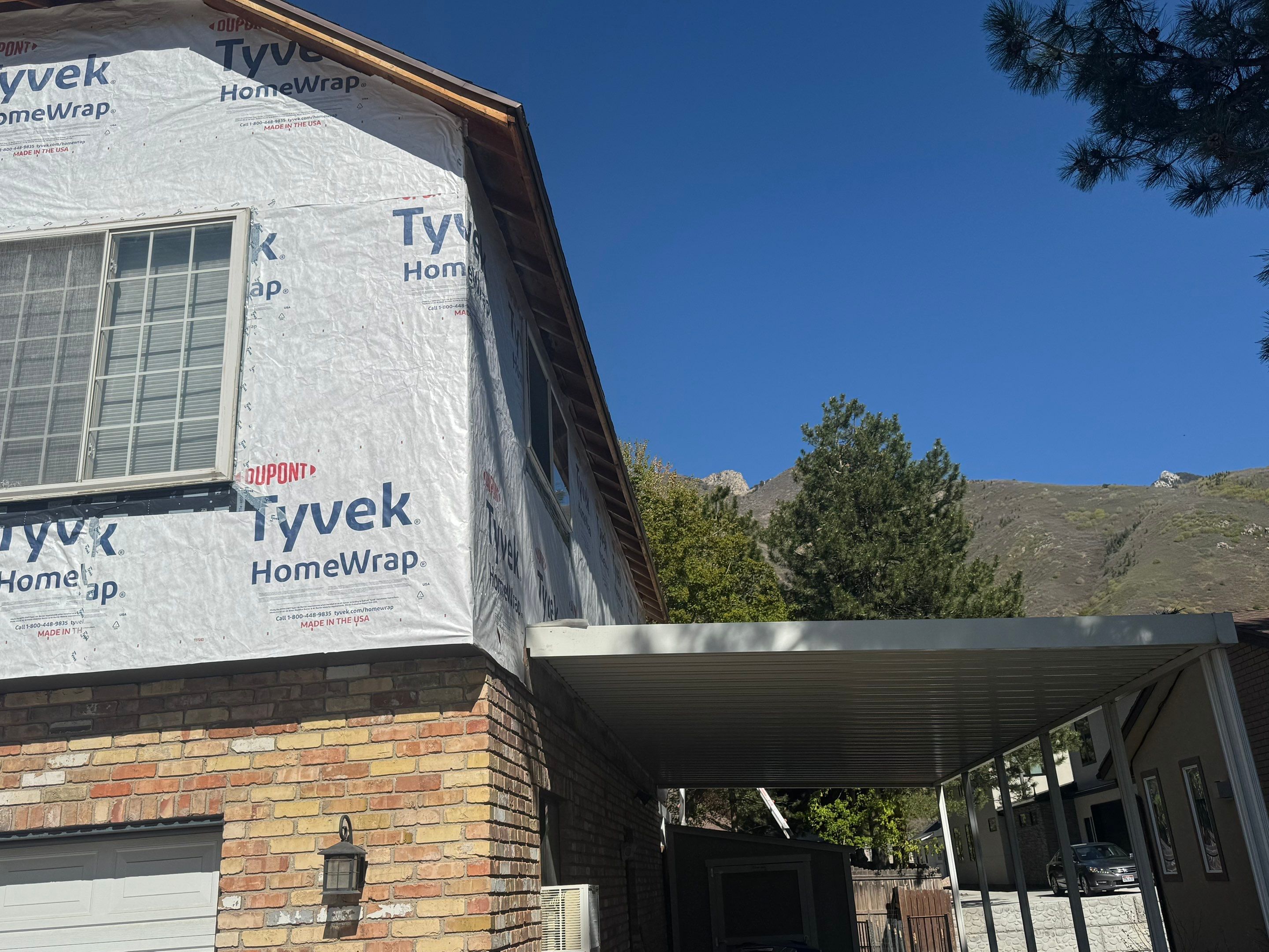 Cottonwood Heights | Custom Hardie Exterior & Bold Fascia | Cobble Stone Accents by Ideal Siding Utah