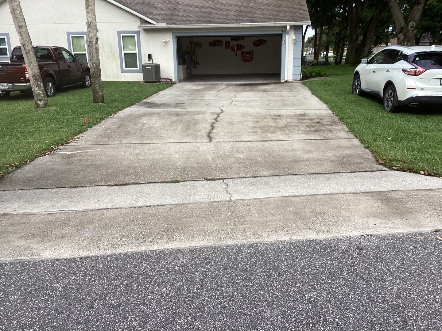Driveway and Garage using Tidal Wave by Amvet concrete coatings llc