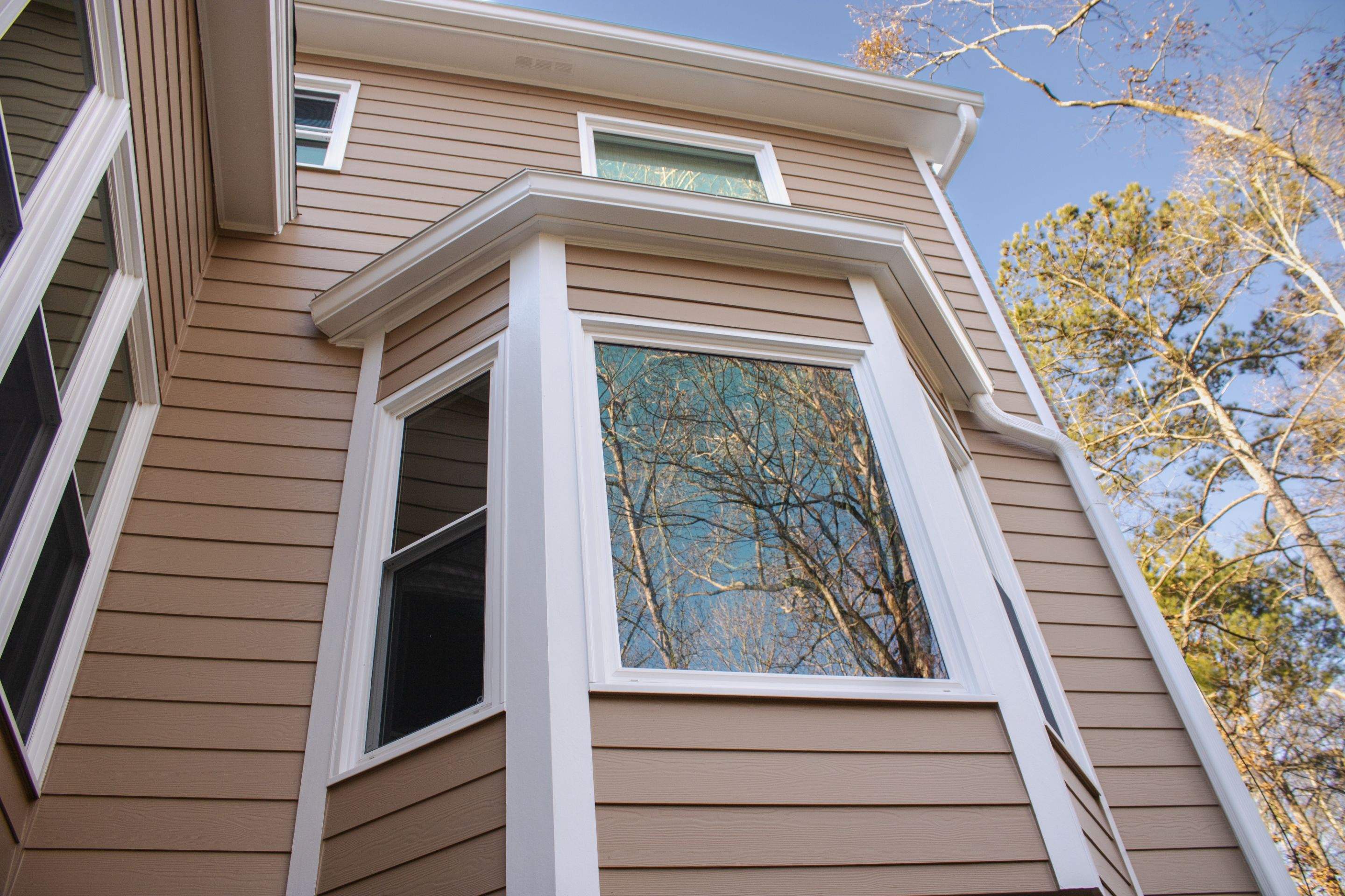 53 Window Replacements with Master 2800 Series Vinyl Replacement Windows and James Hardie Siding Installation by Nelson Exteriors 