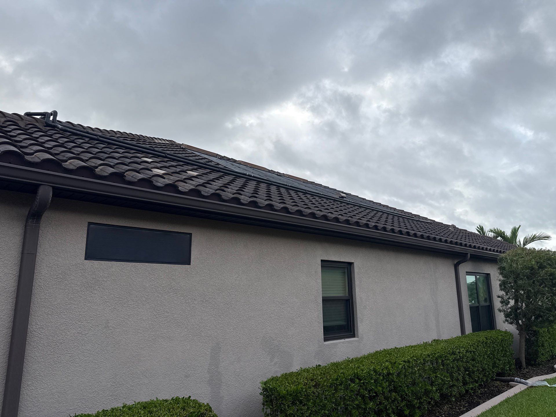 Neighboring Tile Roof Cleaning with Gutter Runoff Control – Palmetto, FL by Sunshine AquaWash