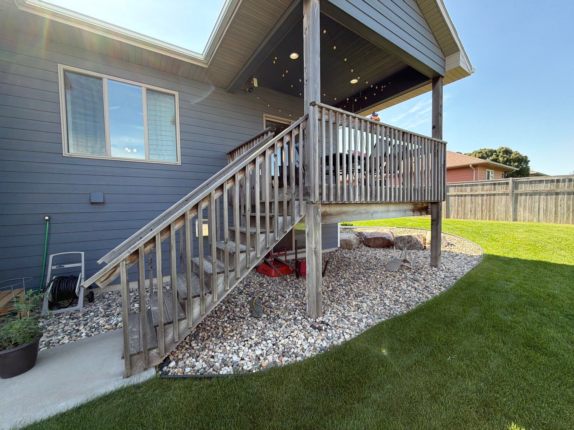 Full Exterior Home Painting on Blue Lap Siding in Sioux Falls by Select Painting, Coatings & Garage Cabinets