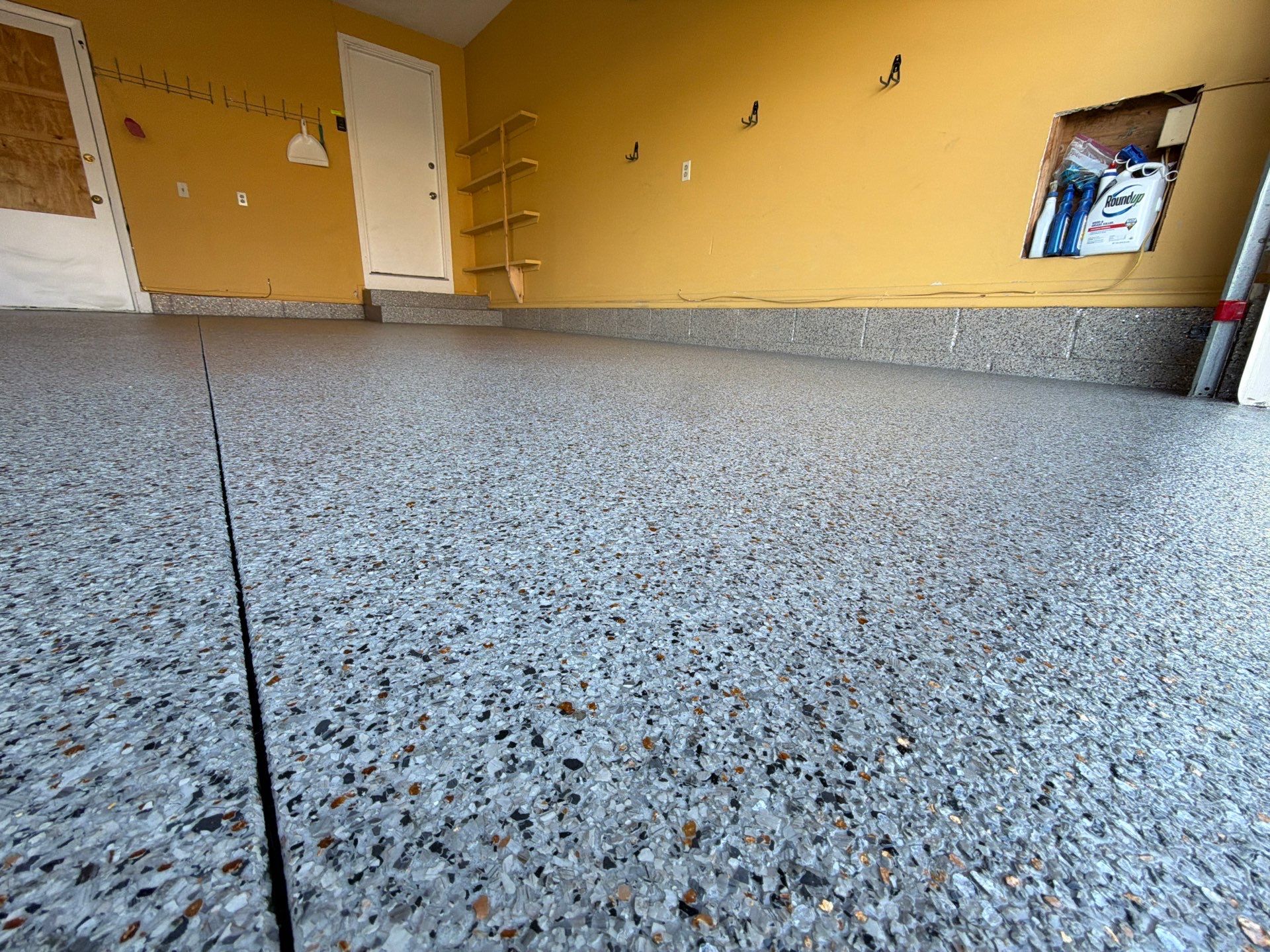 Vintage Goldmine Garage Coating by NG Masonry & Construction LLC