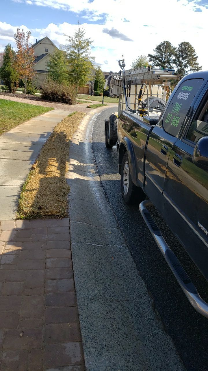 Driveway Clean using cleaner by Power Wash Masters LLC