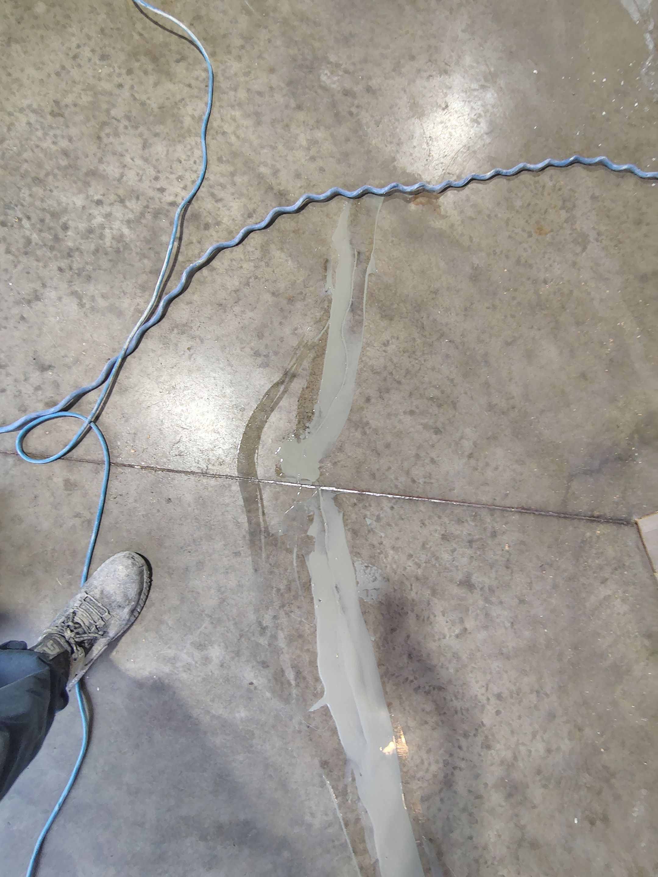 Sioux Falls Garage Concrete Grinding and Nightfall Decorative Chip Coating by Select Painting, Coatings & Garage Cabinets