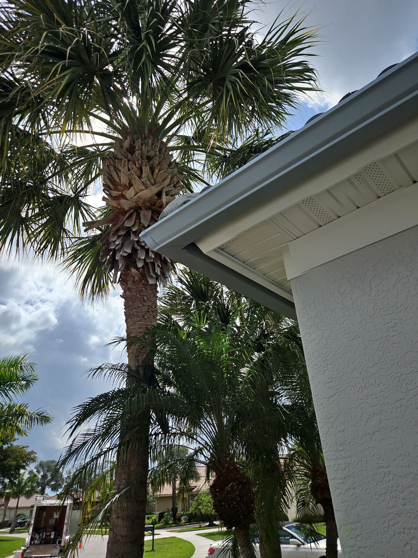 6-inch K-style Seamless Gutters and Splash Guard in Grey Color in Naples FL by Gutter Professors