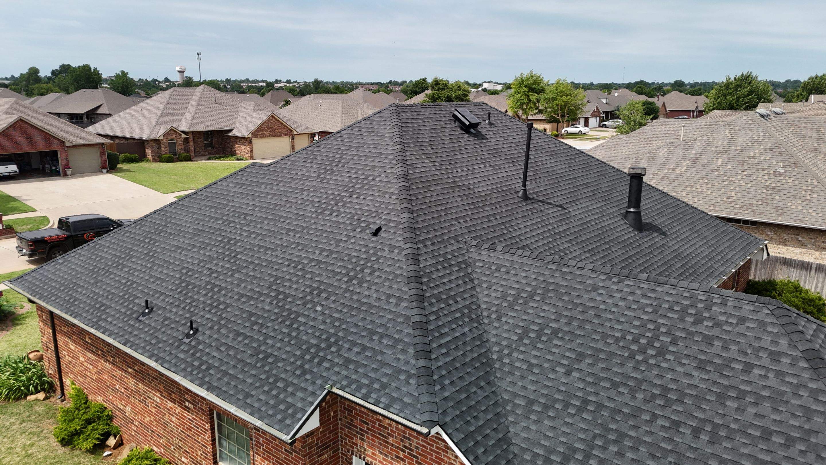 Roof Replacement in Mustang, OK by 5Coat Roofing & Construction